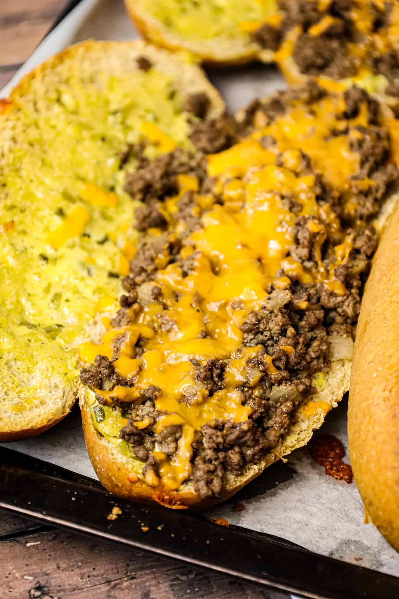 Cheeseburger Subs are an easy family friendly dinner recipe loaded with ground beef, shredded cheddar cheese on a bun spread with a special mayo sauce.