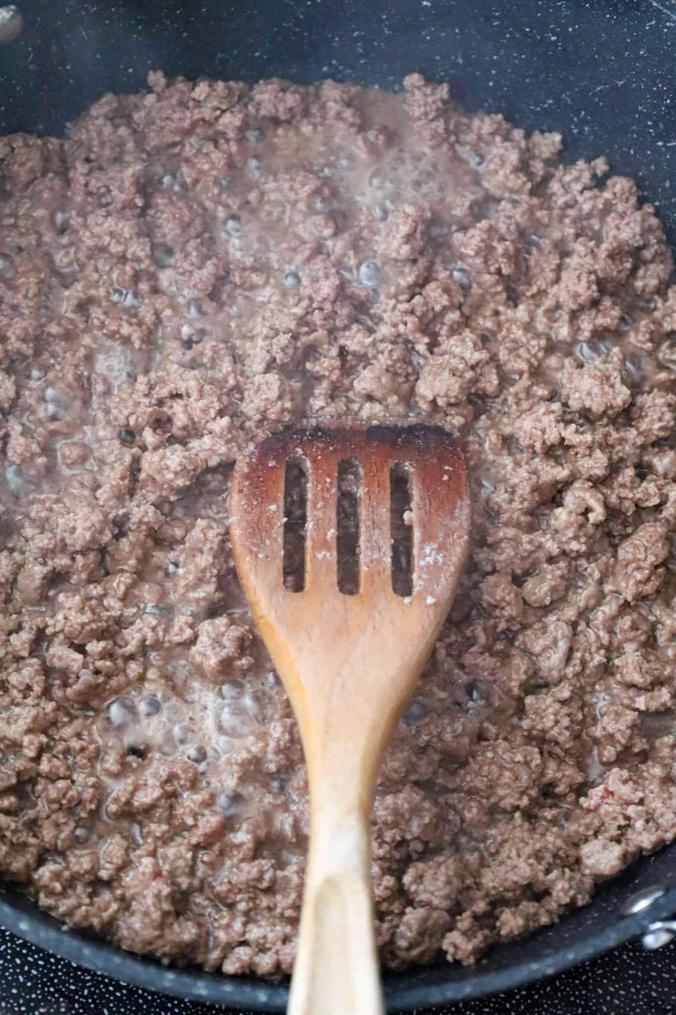 ground beef cooking in a skillet