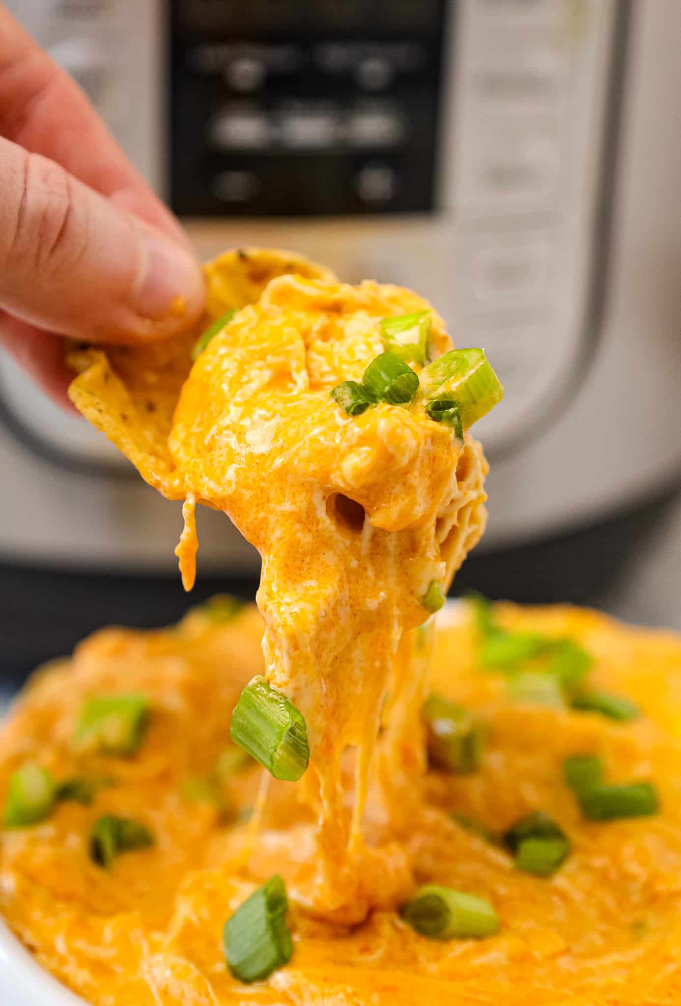 Instant Pot Buffalo Chicken Dip is a delicious pressure cooker party dip recipe loaded with shredded chicken, Buffalo sauce, ranch dressing, cream cheese and a blend of shredded cheeses.