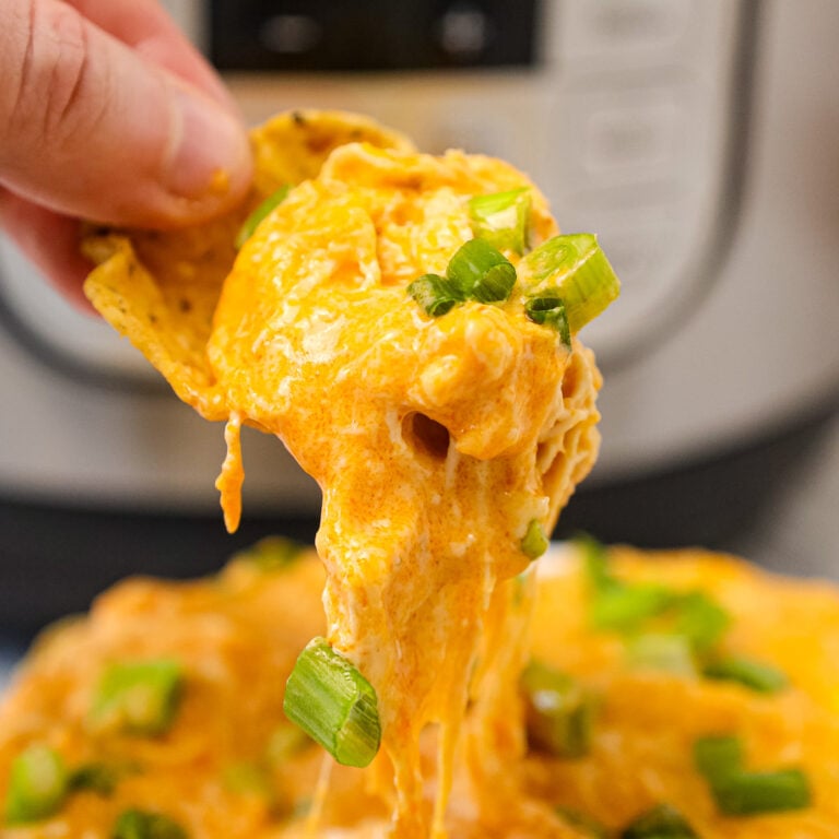 Instant Pot Buffalo Chicken Dip is a delicious pressure cooker party dip recipe loaded with shredded chicken, Buffalo sauce, ranch dressing, cream cheese and a blend of shredded cheeses.