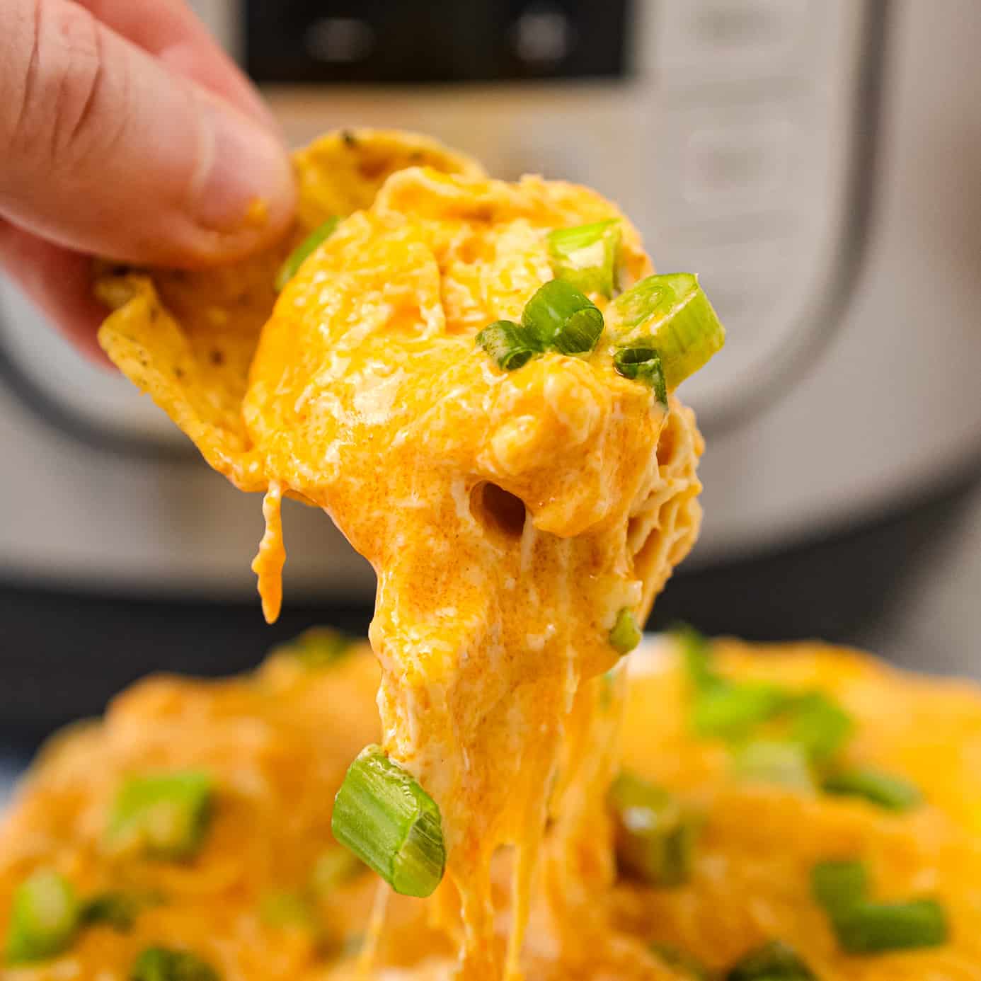Instant Pot Buffalo Chicken Dip is a delicious pressure cooker party dip recipe loaded with shredded chicken, Buffalo sauce, ranch dressing, cream cheese and a blend of shredded cheeses.