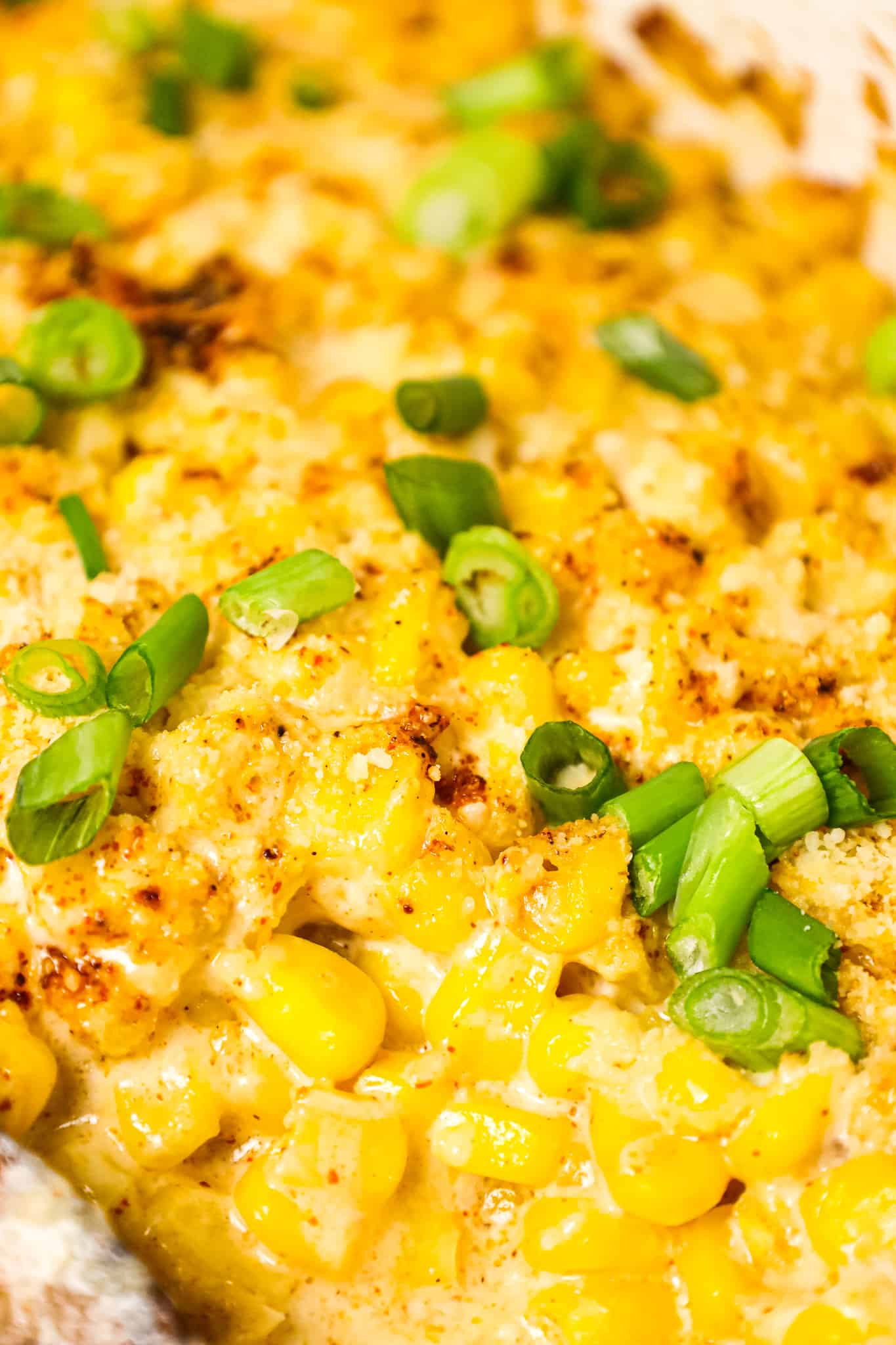 Mexican Corn Casserole is a creamy corn casserole made with frozen corn kernels tossed in sour cream, mayo, chili powder, garlic powder and parmesan cheese.