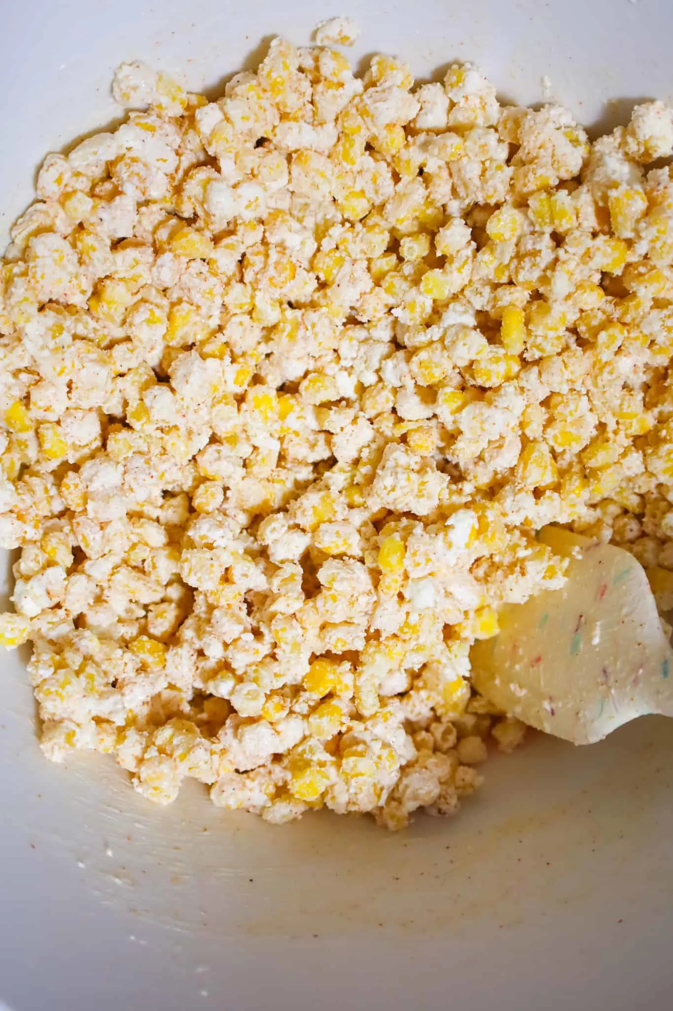 frozen corn mixture in a mixing bowl