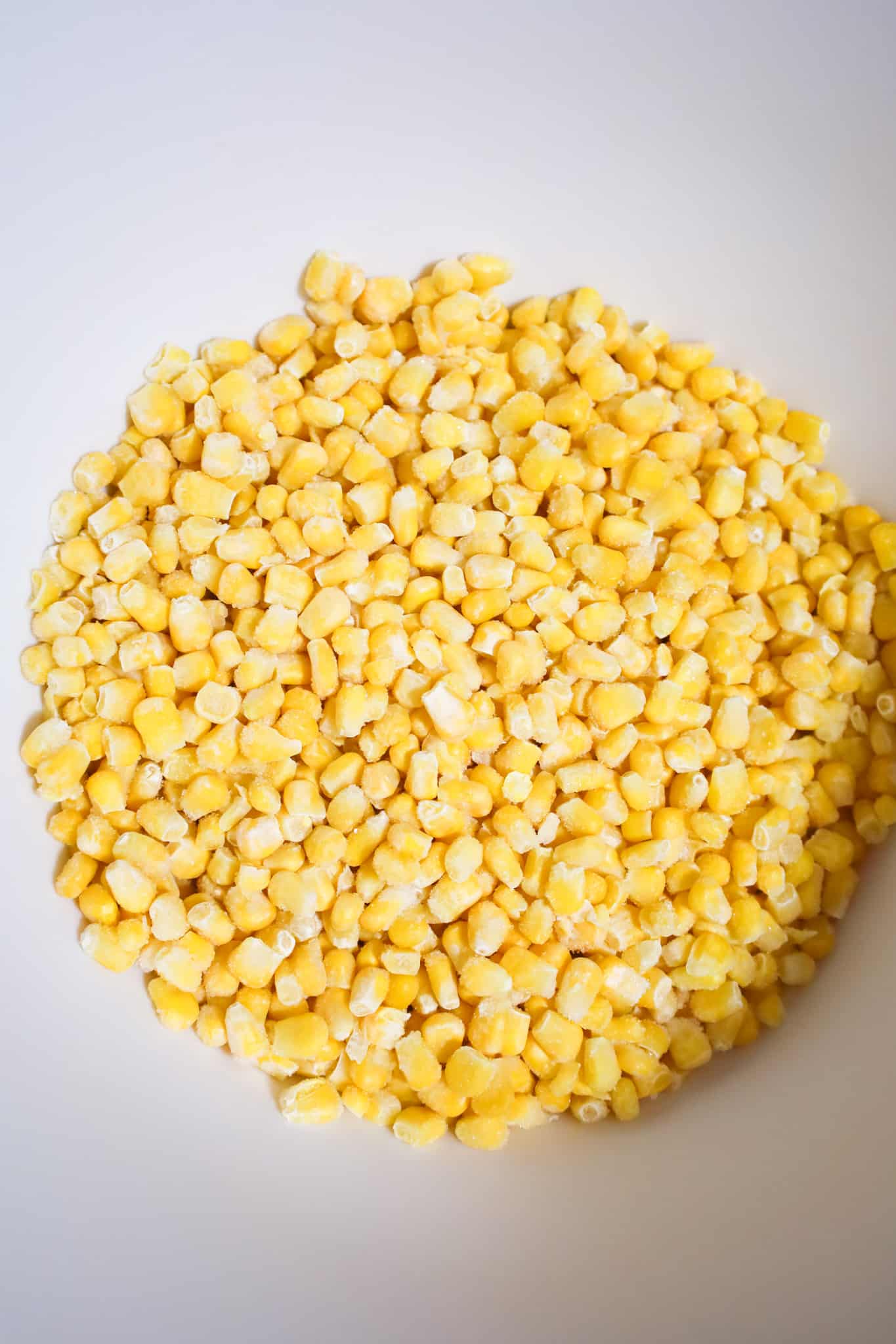 frozen corn kernels in a mixing bowl