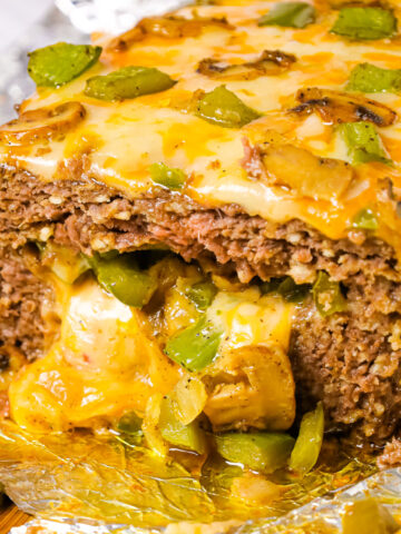 Philly Cheese Steak Meatloaf is a hearty ground beef meatloaf loaded with onions, green peppers, mushrooms and cheese.