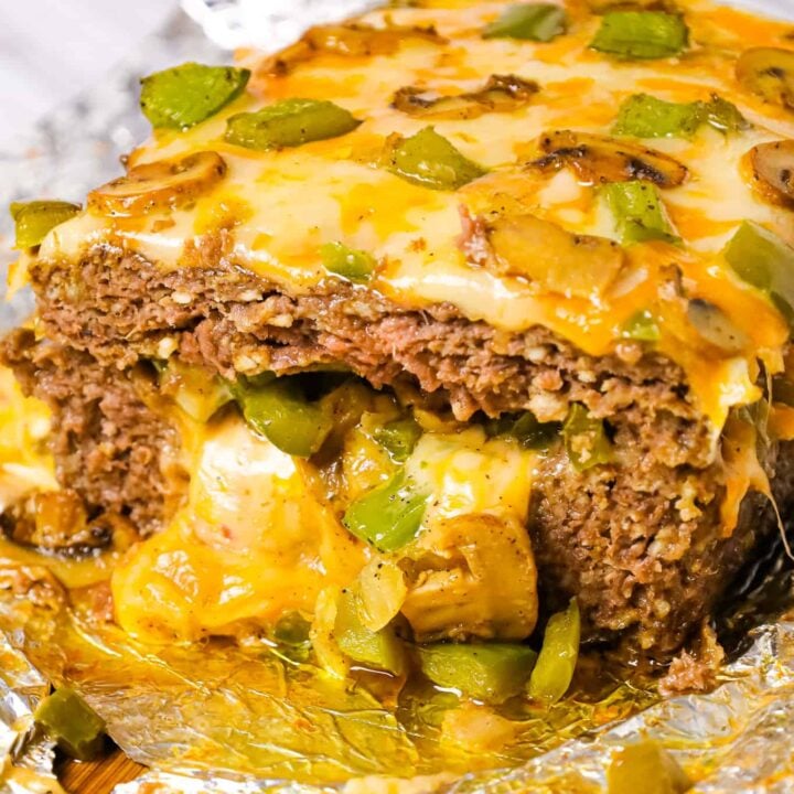 Philly Cheese Steak Meatloaf is a hearty ground beef meatloaf loaded with onions, green peppers, mushrooms and cheese.