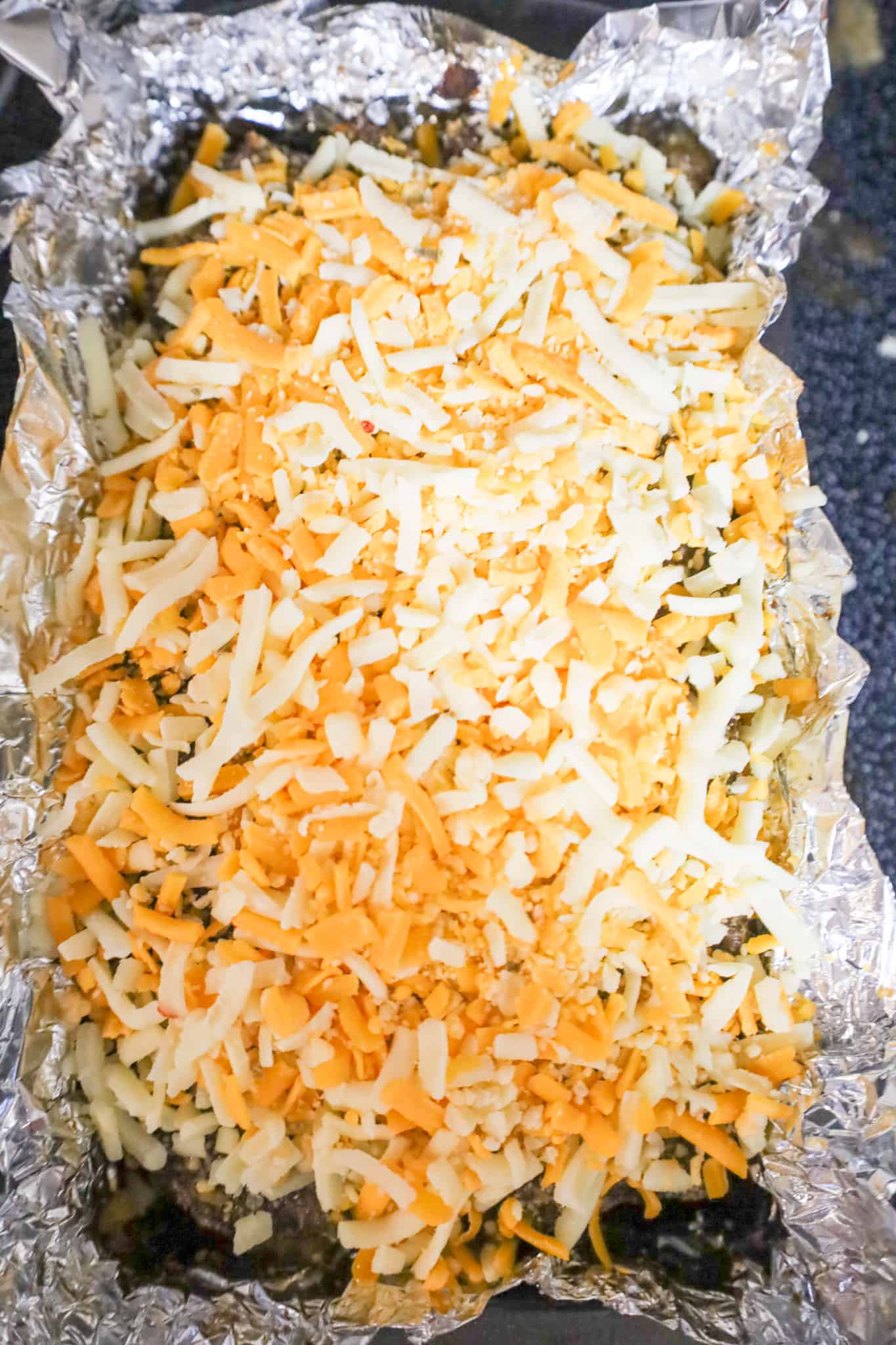 shredded cheese on top of meatloaf