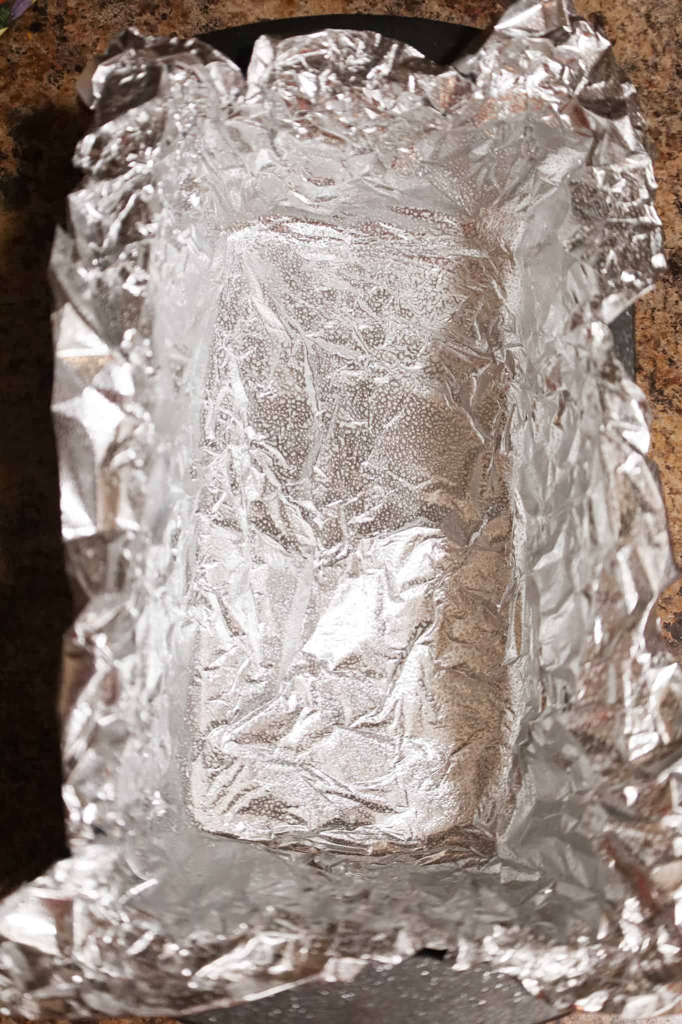 aluminum foil lining a loaf pan