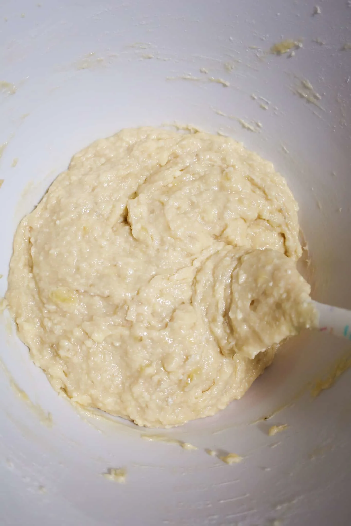 banana bread batter after stirring in a mixing bowl