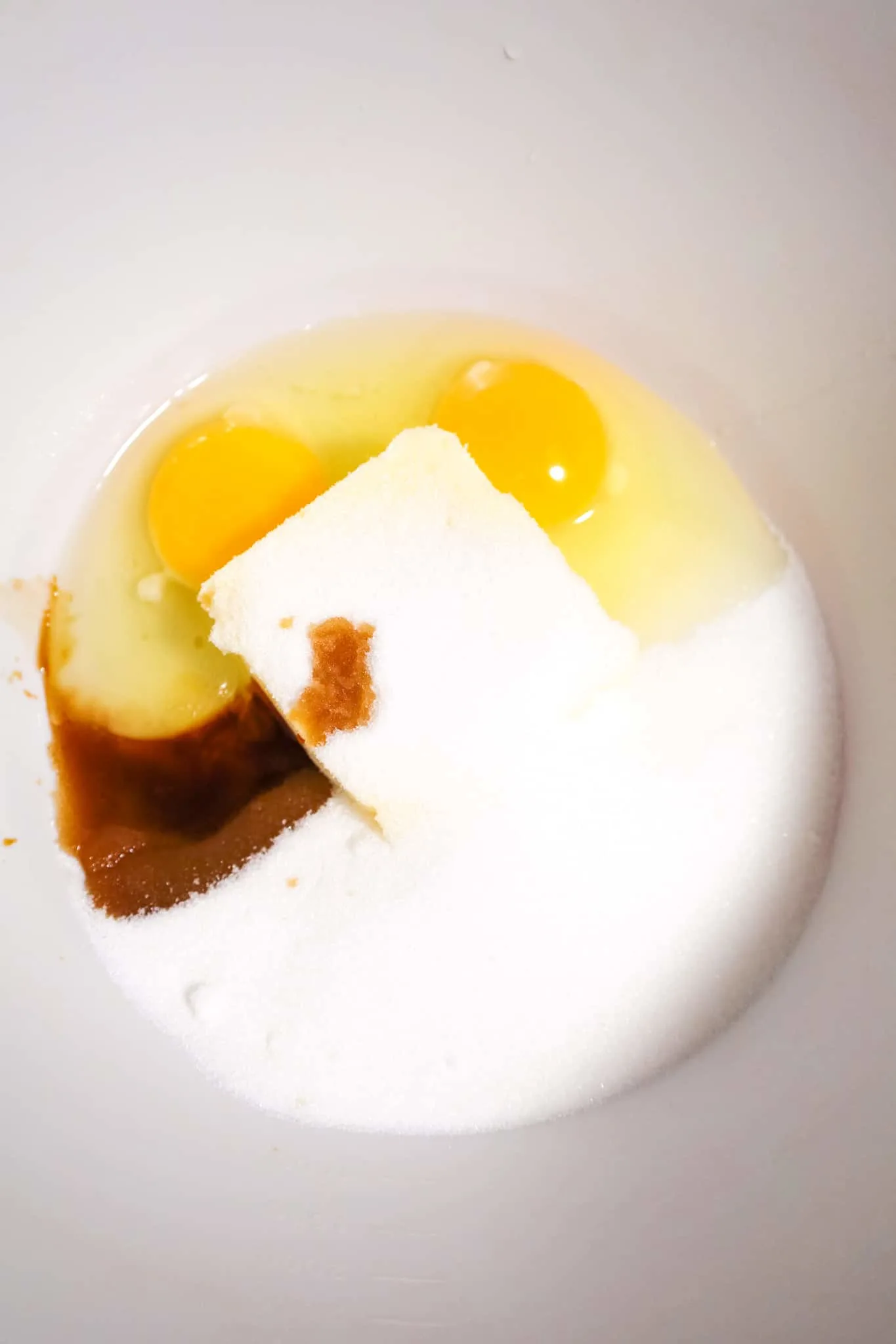 granulated sugar, butter, vanilla extract and eggs in a mixing bowl