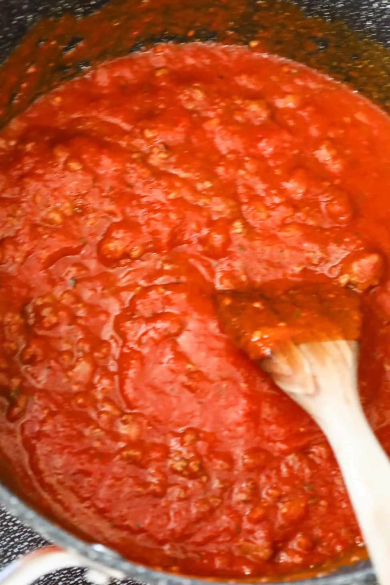 marinara sauce and cooked ground beef in a large pot
