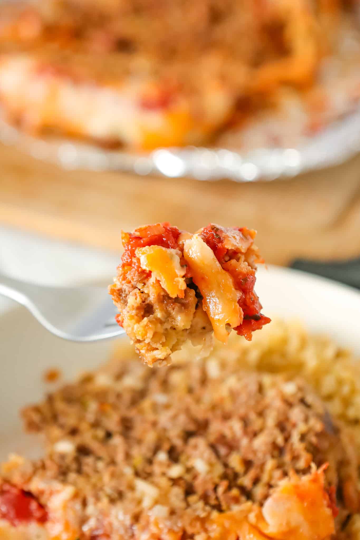 Taco Meatloaf is a delicious ground beef meatloaf recipe loaded with crushed Fritos corn chips, salsa, taco seasoning and shredded cheese.