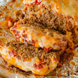 Taco Meatloaf is a delicious ground beef meatloaf recipe loaded with crushed Fritos corn chips, salsa, taco seasoning and shredded cheese.