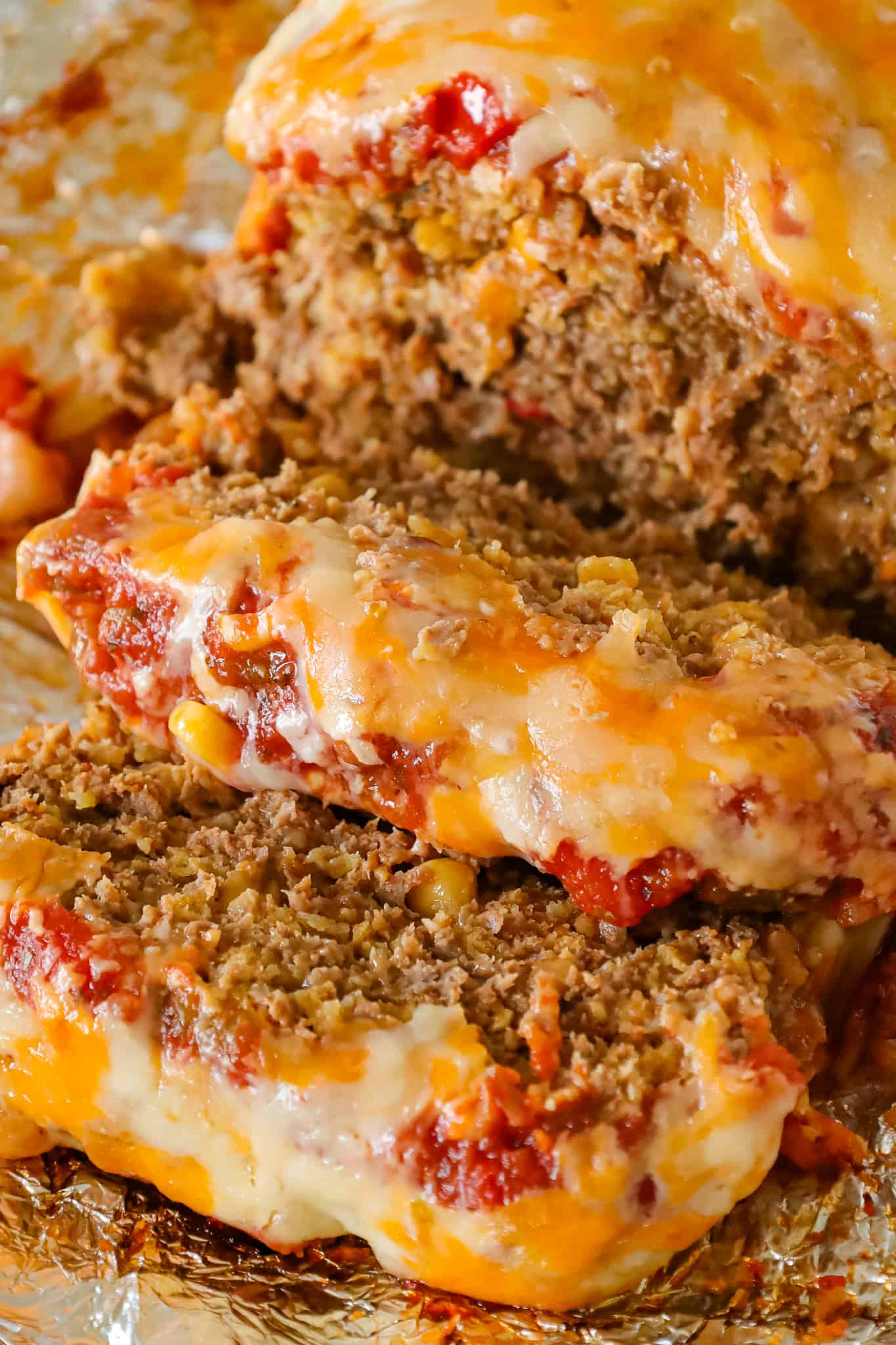 Taco Meatloaf is a delicious ground beef meatloaf recipe loaded with crushed Fritos corn chips, salsa, taco seasoning and shredded cheese.