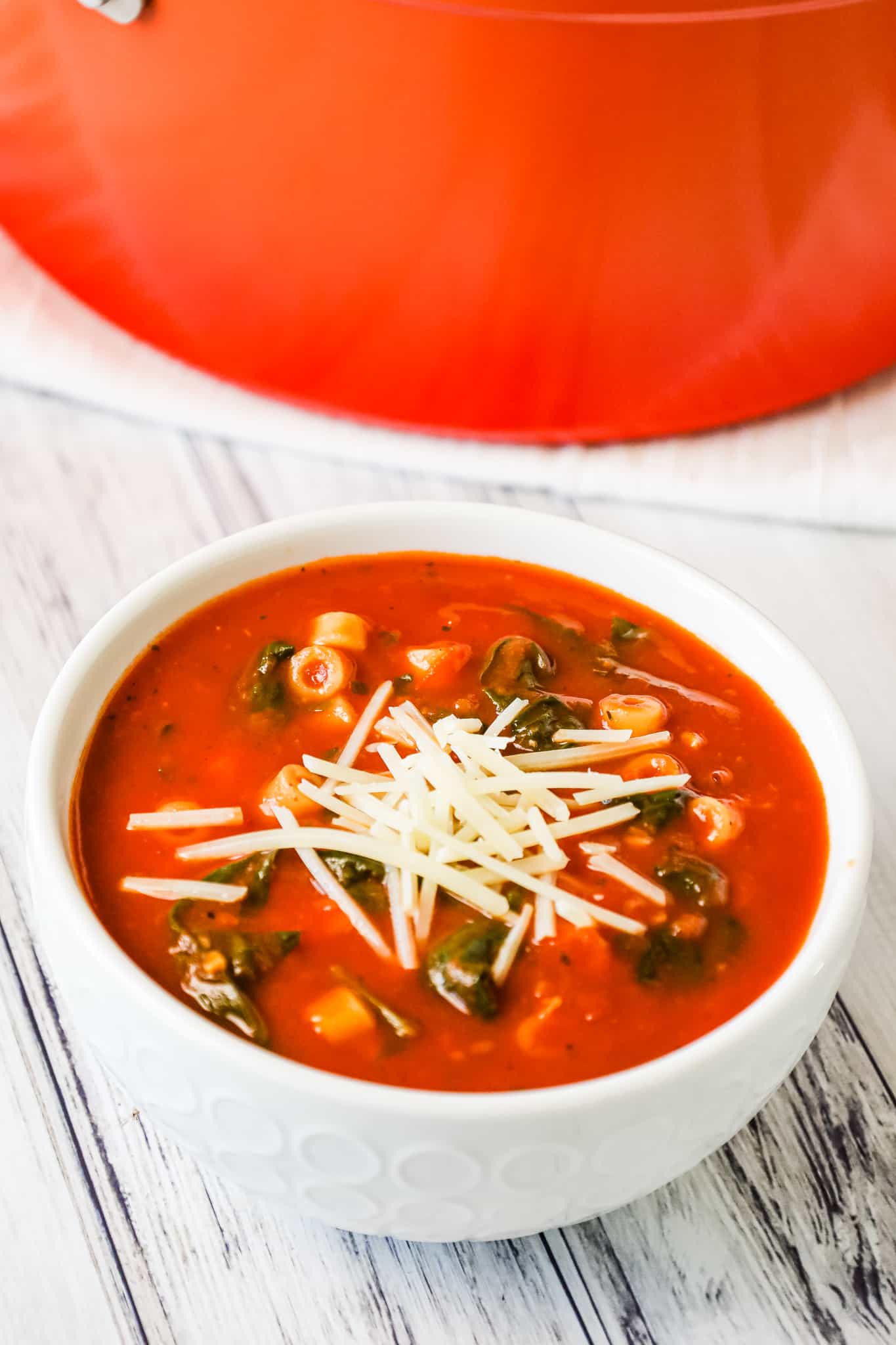 Tomato Florentine Soup is a hearty soup recipe made with crushed tomatoes and loaded with baby spinach and pasta.