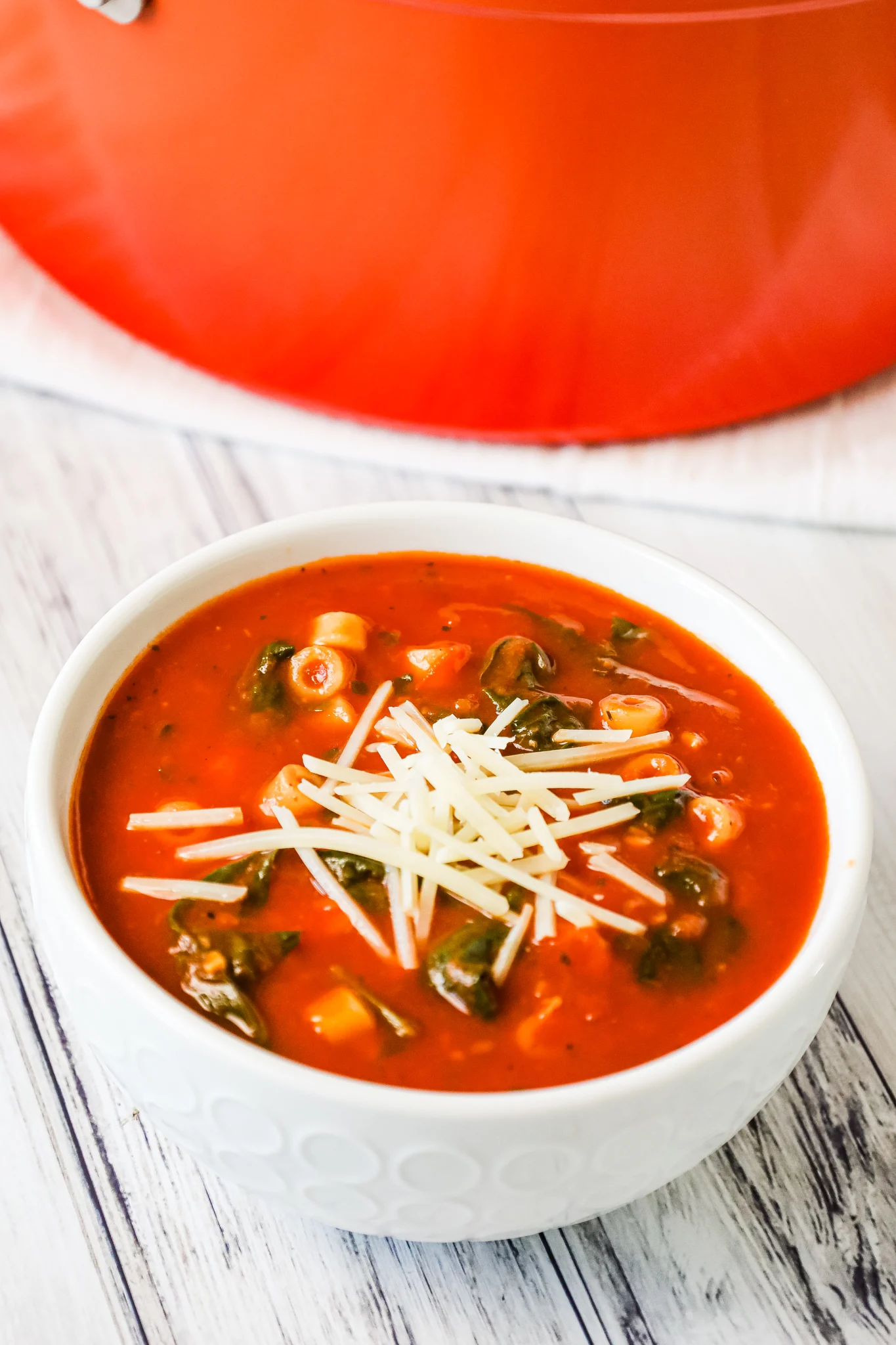 Tomato Florentine Soup is a hearty soup recipe made with crushed tomatoes and loaded with baby spinach and pasta.