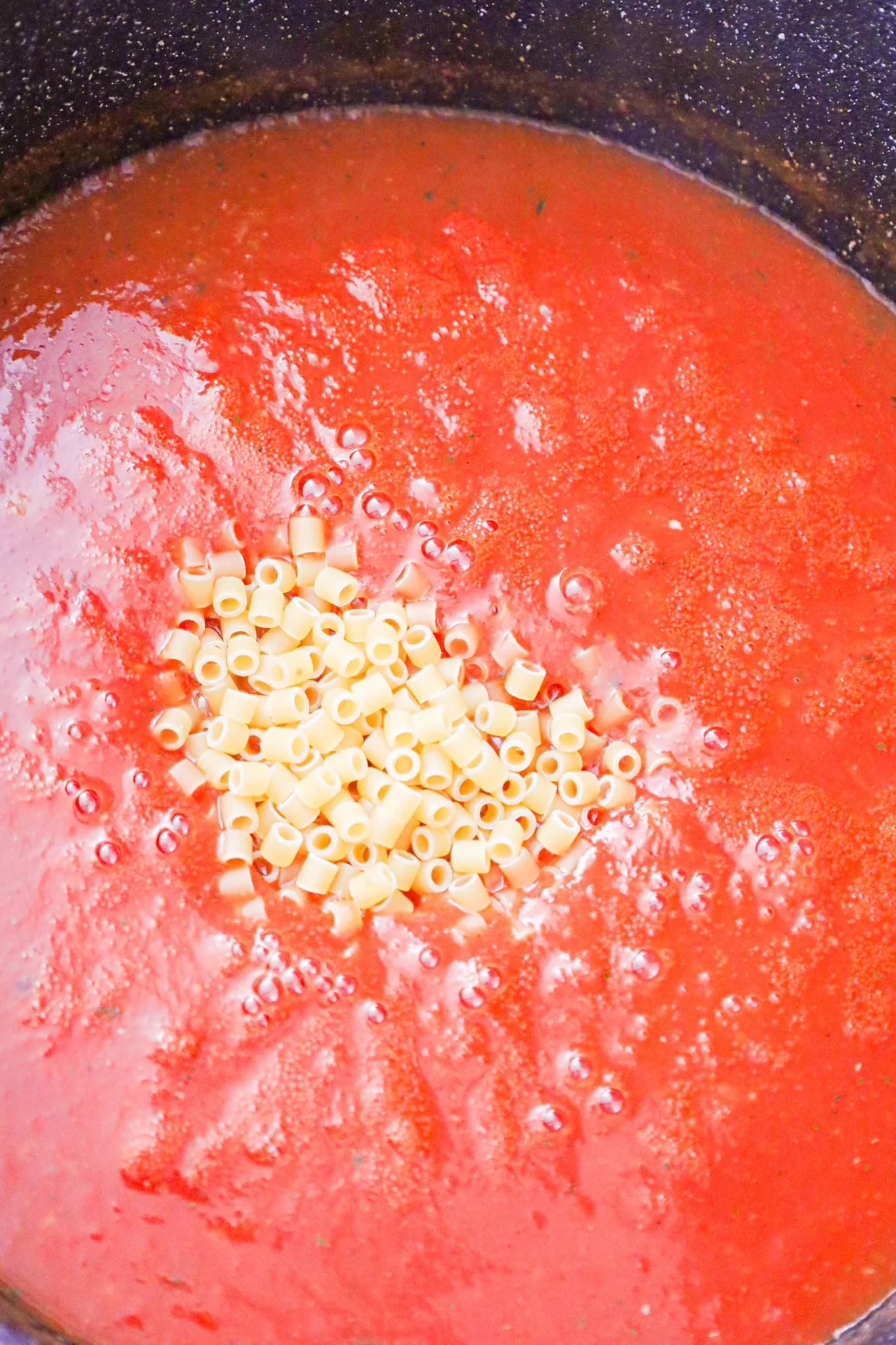 uncooked ditalini noodles added to tomato soup