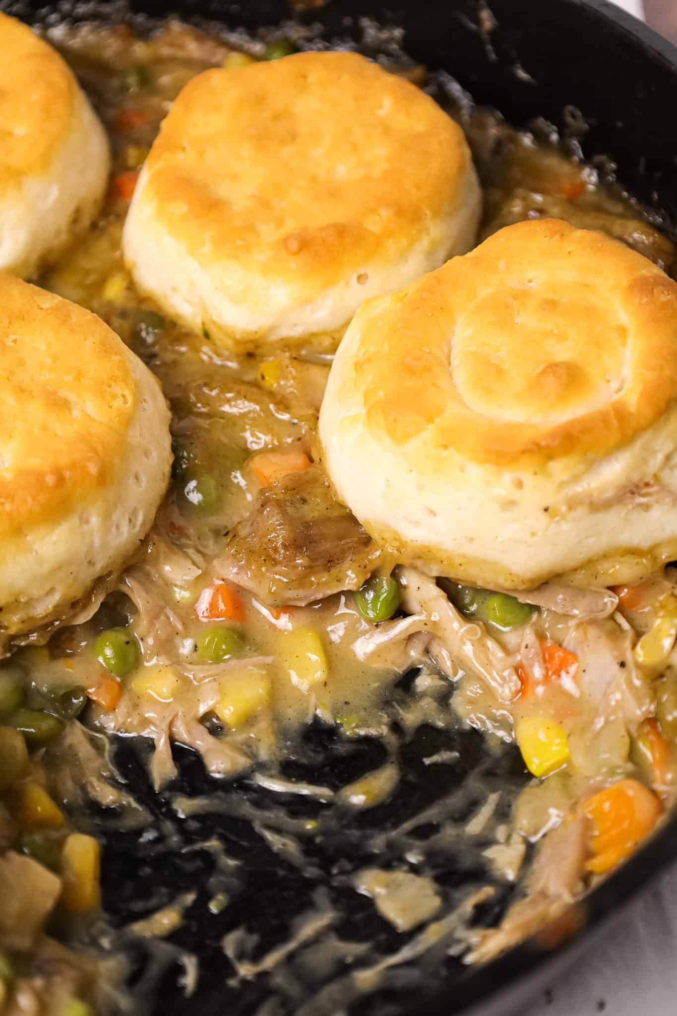 Turkey Pot Pie with Biscuits is an easy recipe loaded with frozen veggies, leftover Thanksgiving turkey, cream of chicken soup and refrigerated biscuits.