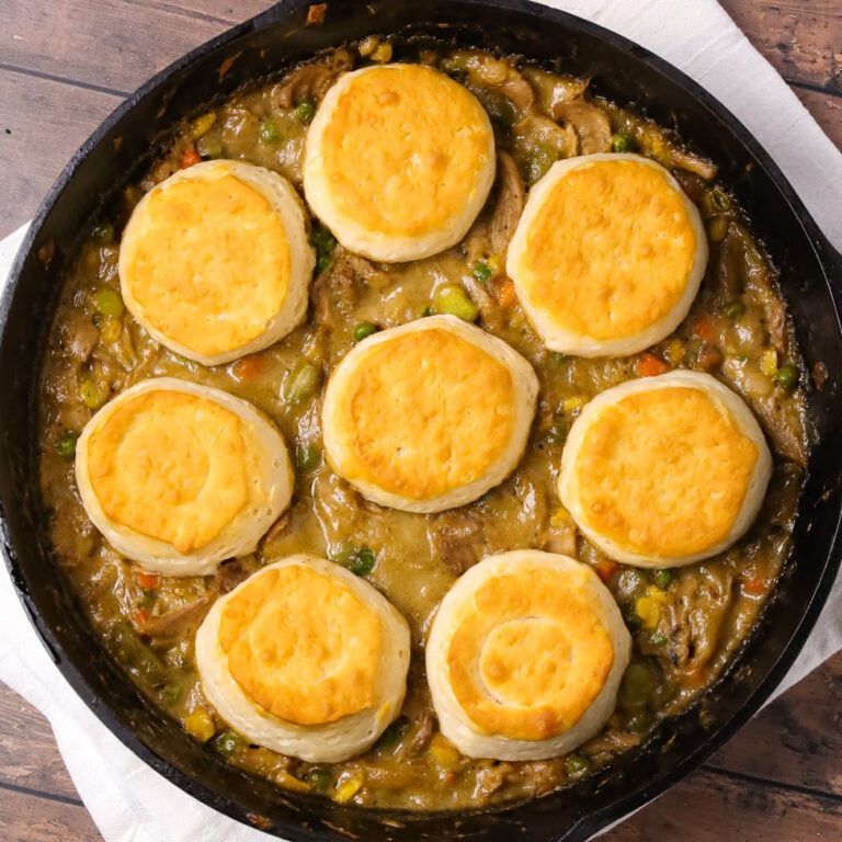 Turkey Pot Pie with Biscuits is an easy recipe loaded with frozen veggies, leftover Thanksgiving turkey, cream of chicken soup and refrigerated biscuits.