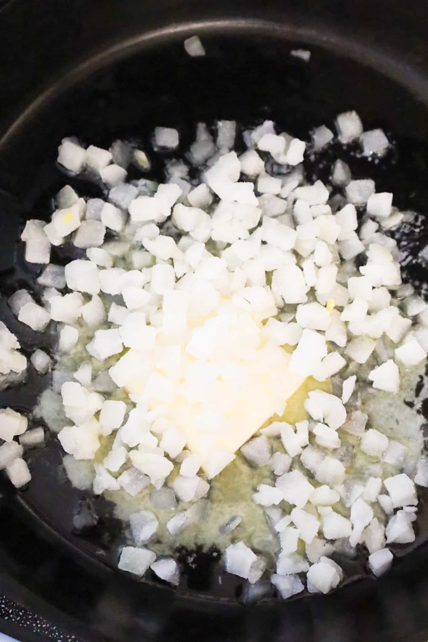 diced onions and butter in a cast iron skillet