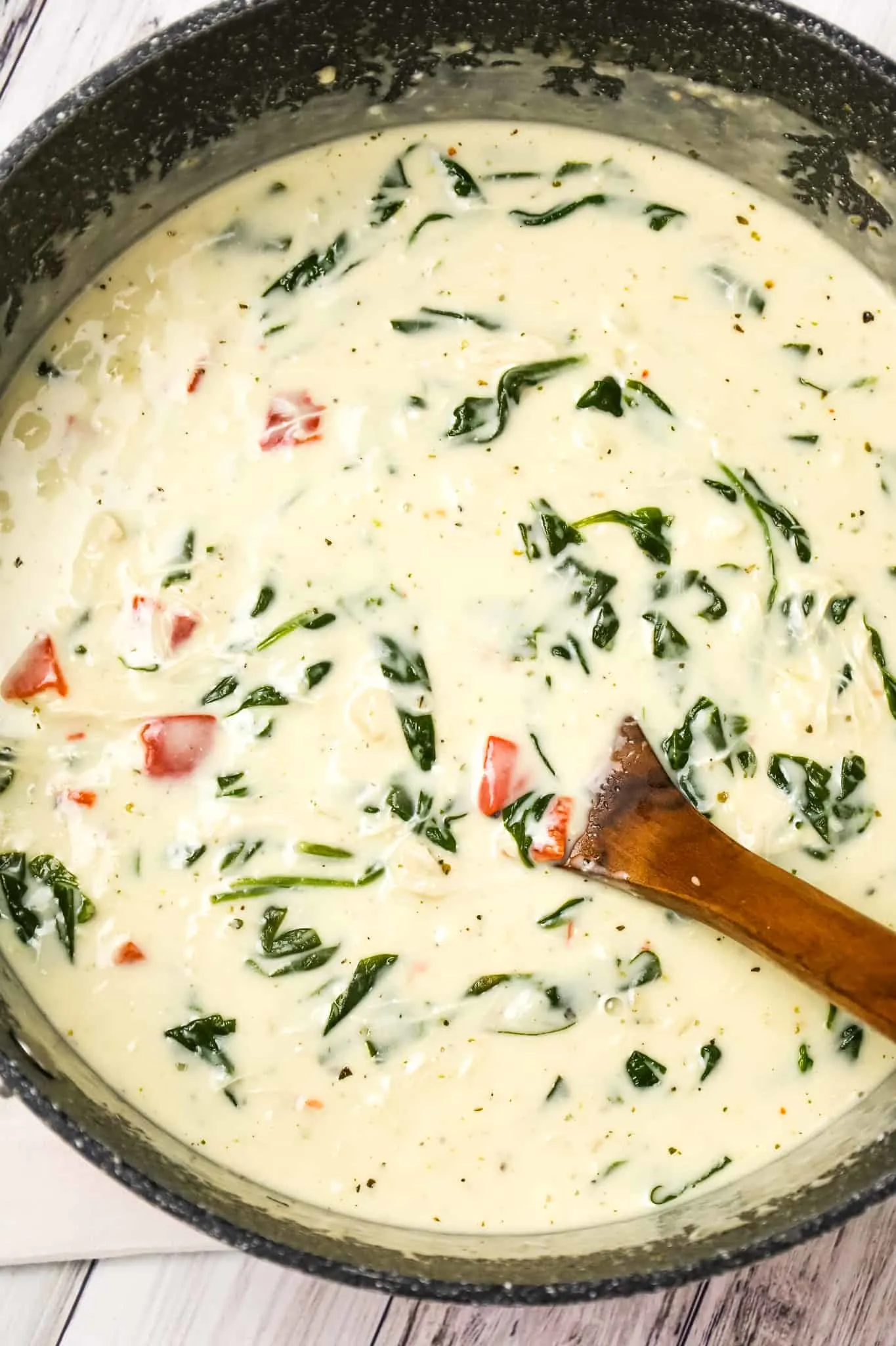 Chicken Florentine Soup is a creamy soup recipe loaded with baby spinach, shredded chicken and roasted red peppers.