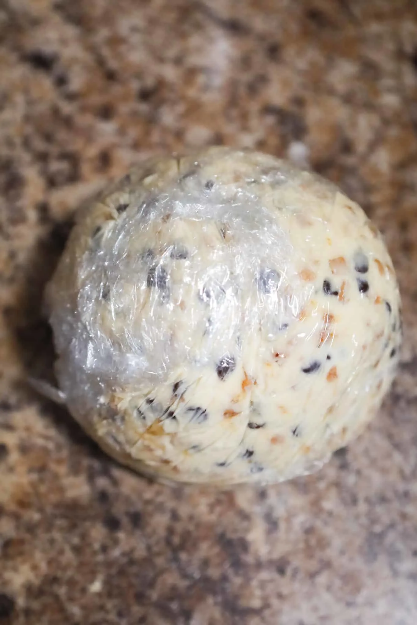 cream cheese ball wrapped in plastic