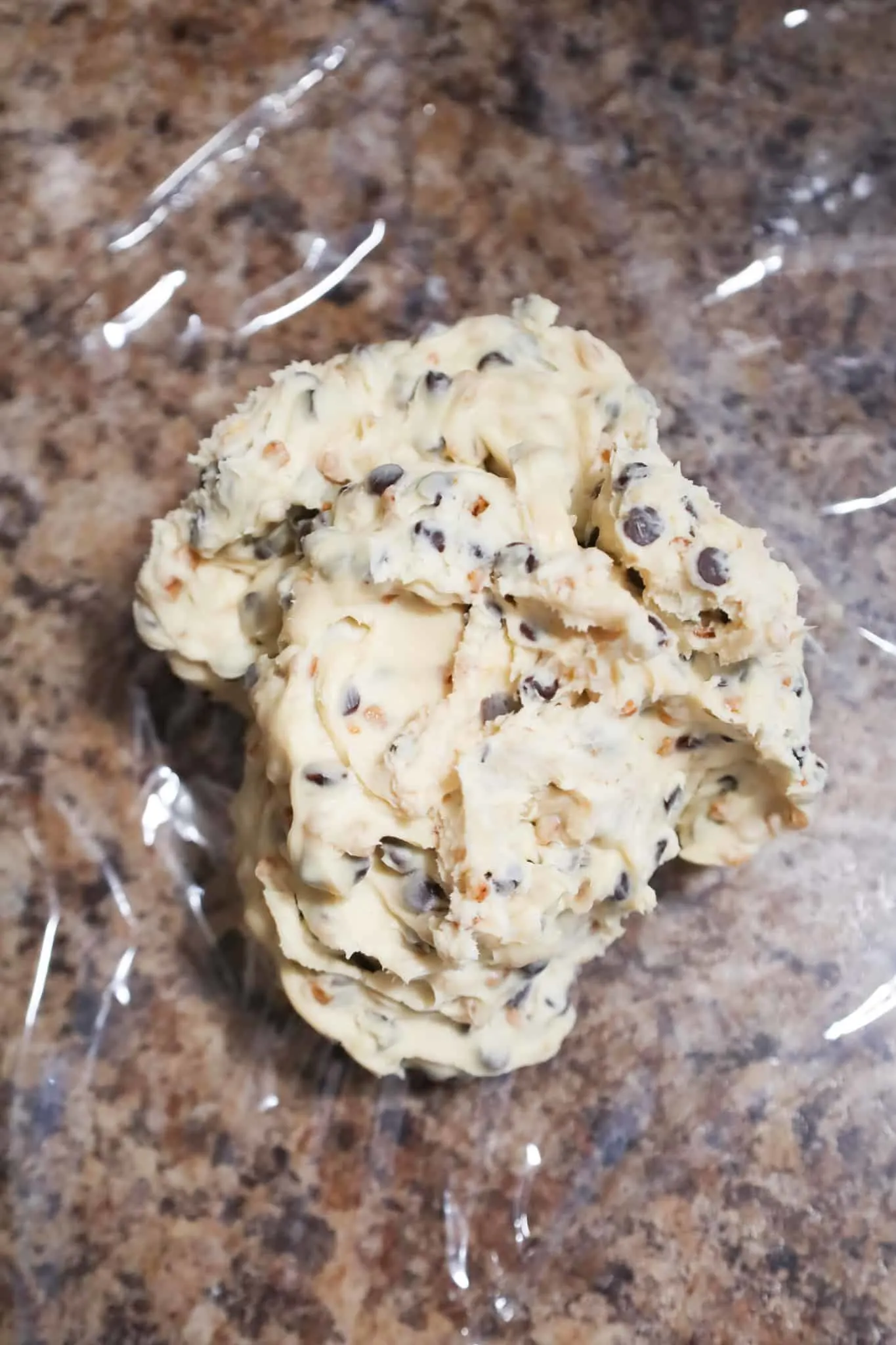 chocolate chip cream cheese mixture on top of plastic wrap