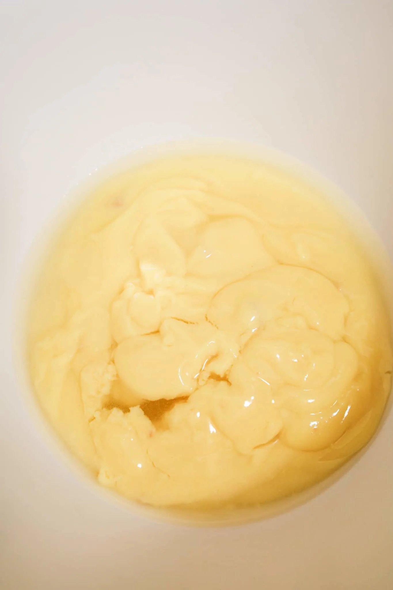 water and condensed cream of chicken soup in a mixing bowl