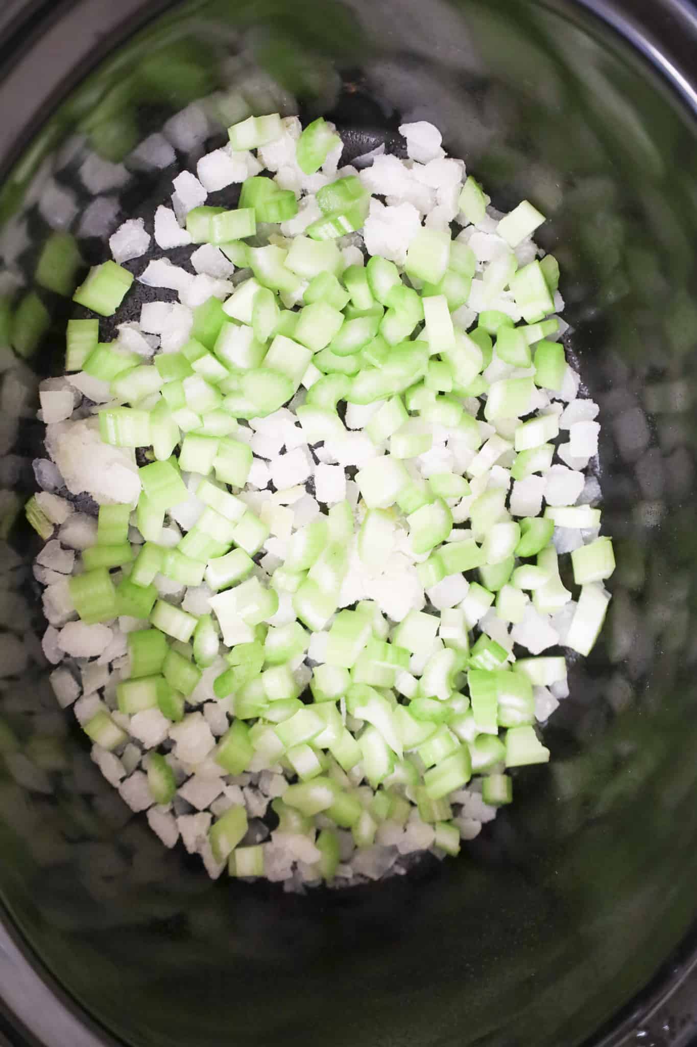 diced celery and diced onions in a crock pot