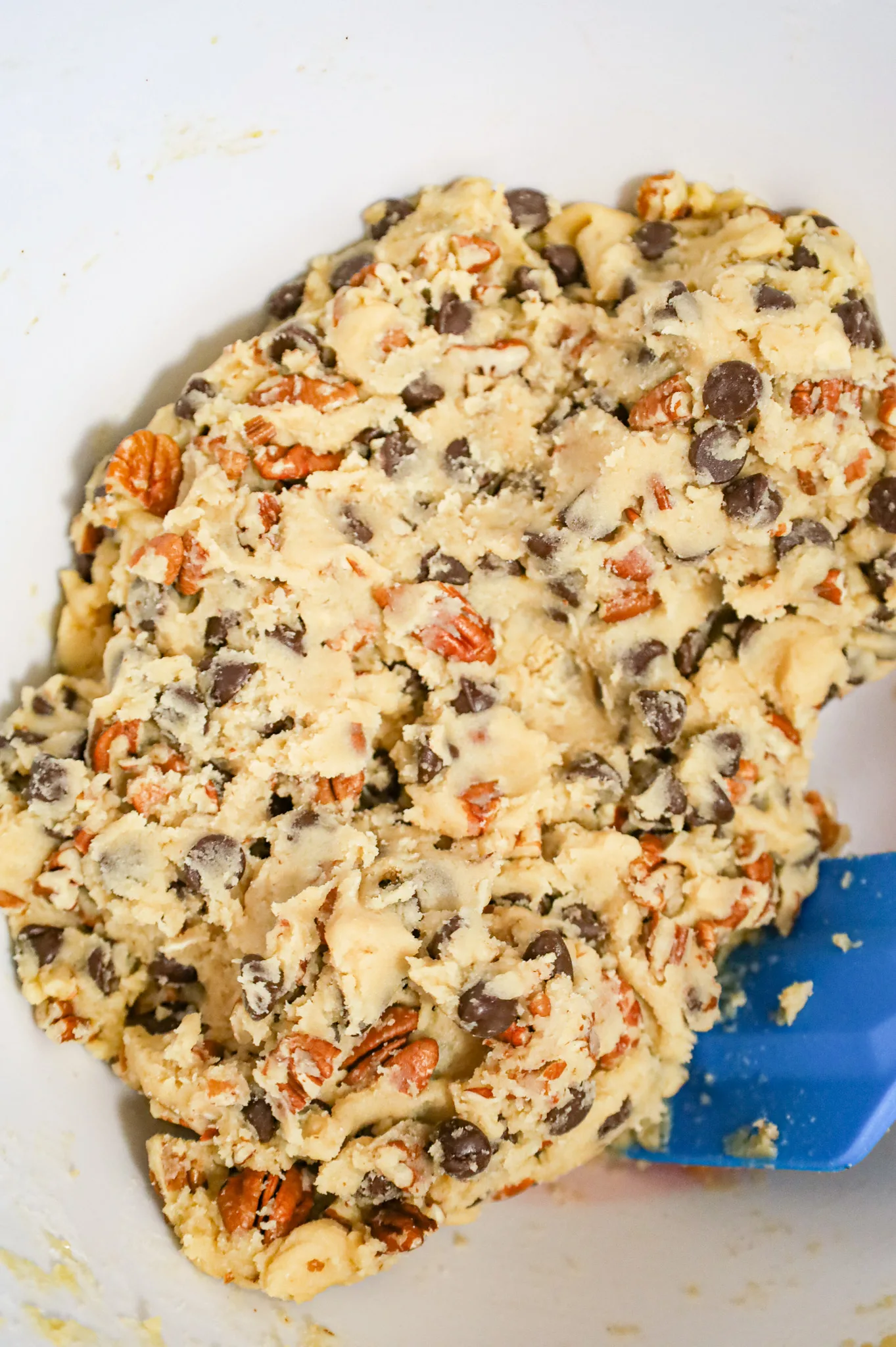 chocolate chip pecan cookie dough in a mixing bowl