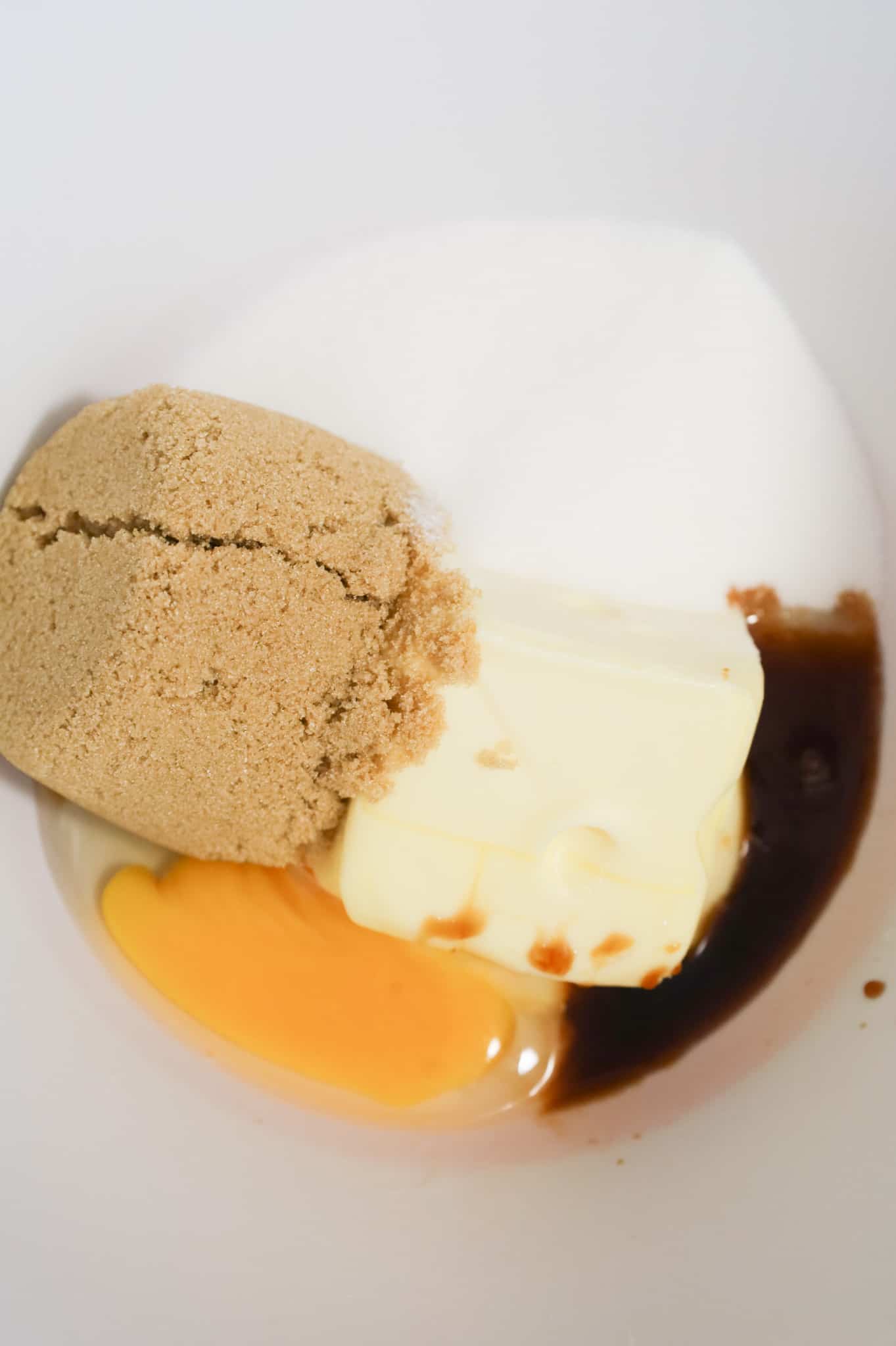 brown sugar, softened butter, granulated sugar, egg and vanilla extract in a mixing bowl
