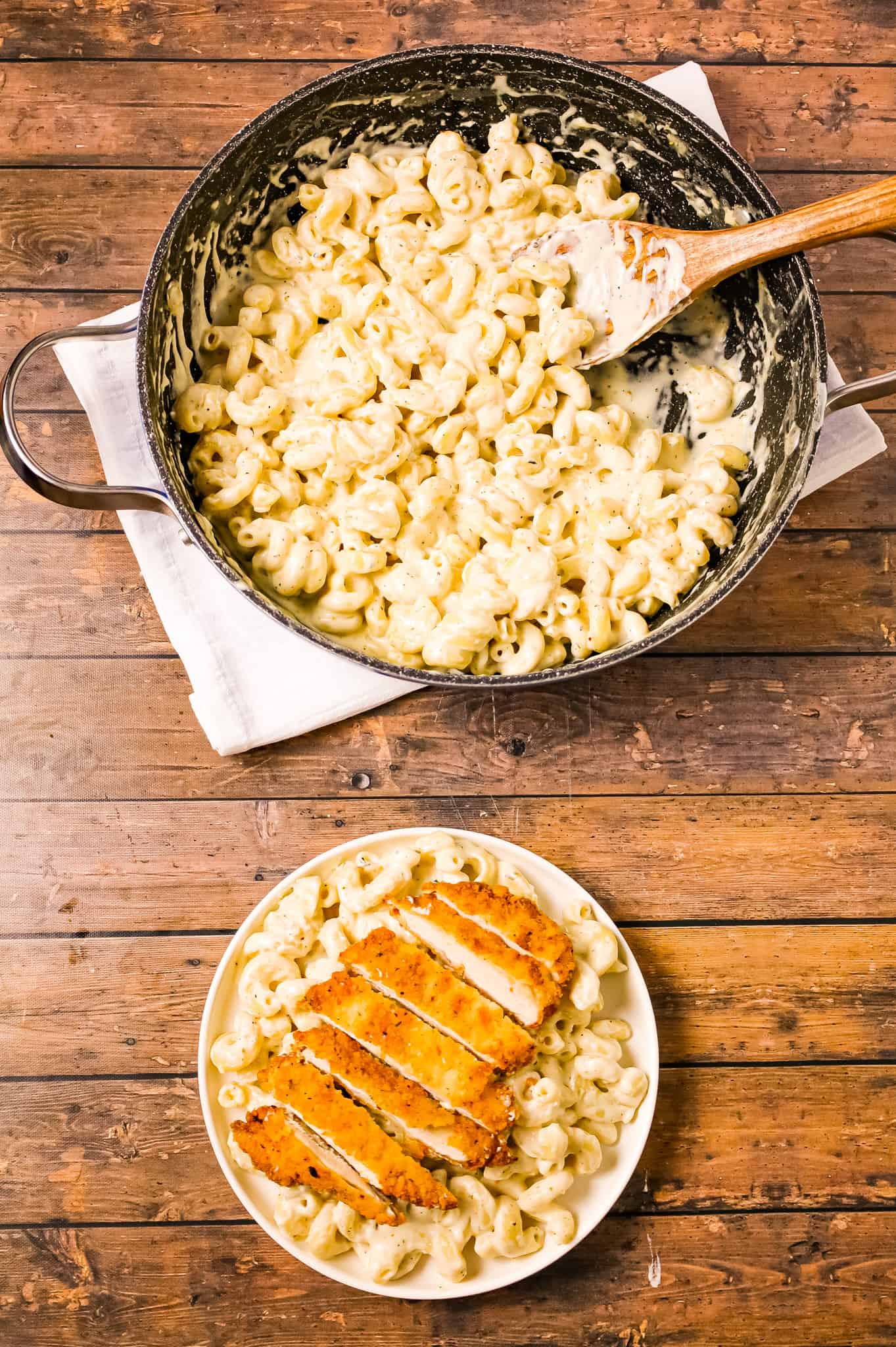 Crispy Chicken Fritta is delicious parmesan crusted chicken breasts served over creamy garlic and asiago cheese cavatappi pasta.