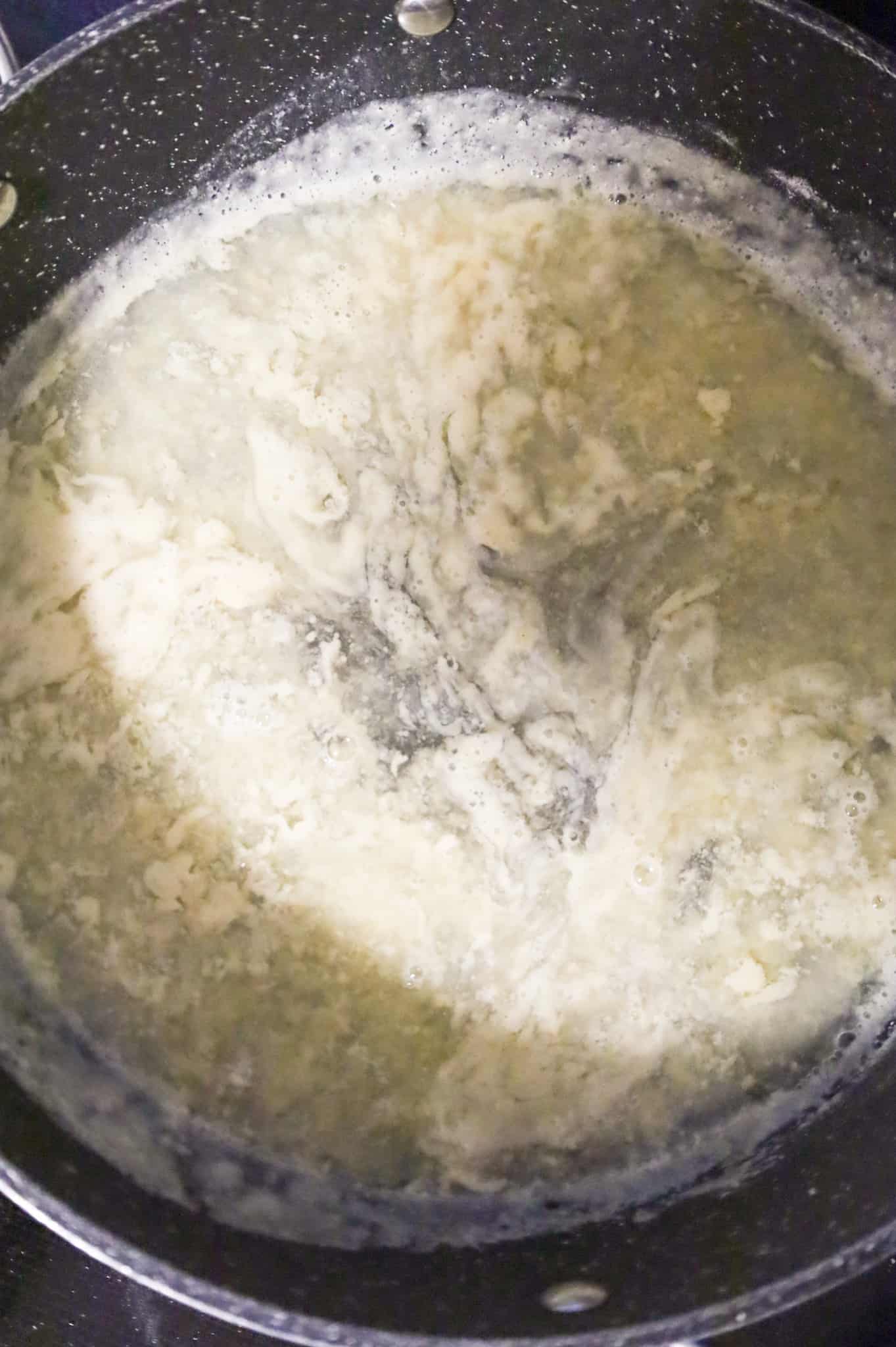 chicken broth added to skillet with flour and butter mixture