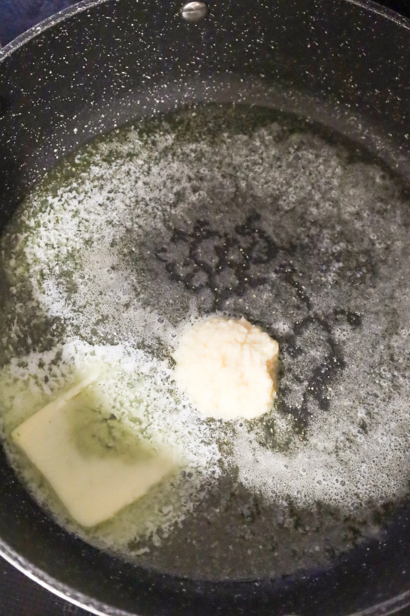 garlic puree and butter in a skillet