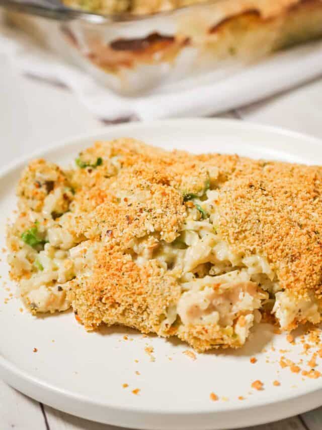 Old School Chicken and Rice Casserole is an easy dinner recipe using shredded rotisserie chicken, three flavours of cream soups, instant rice, green onions, parmesan cheese and bread crumbs.