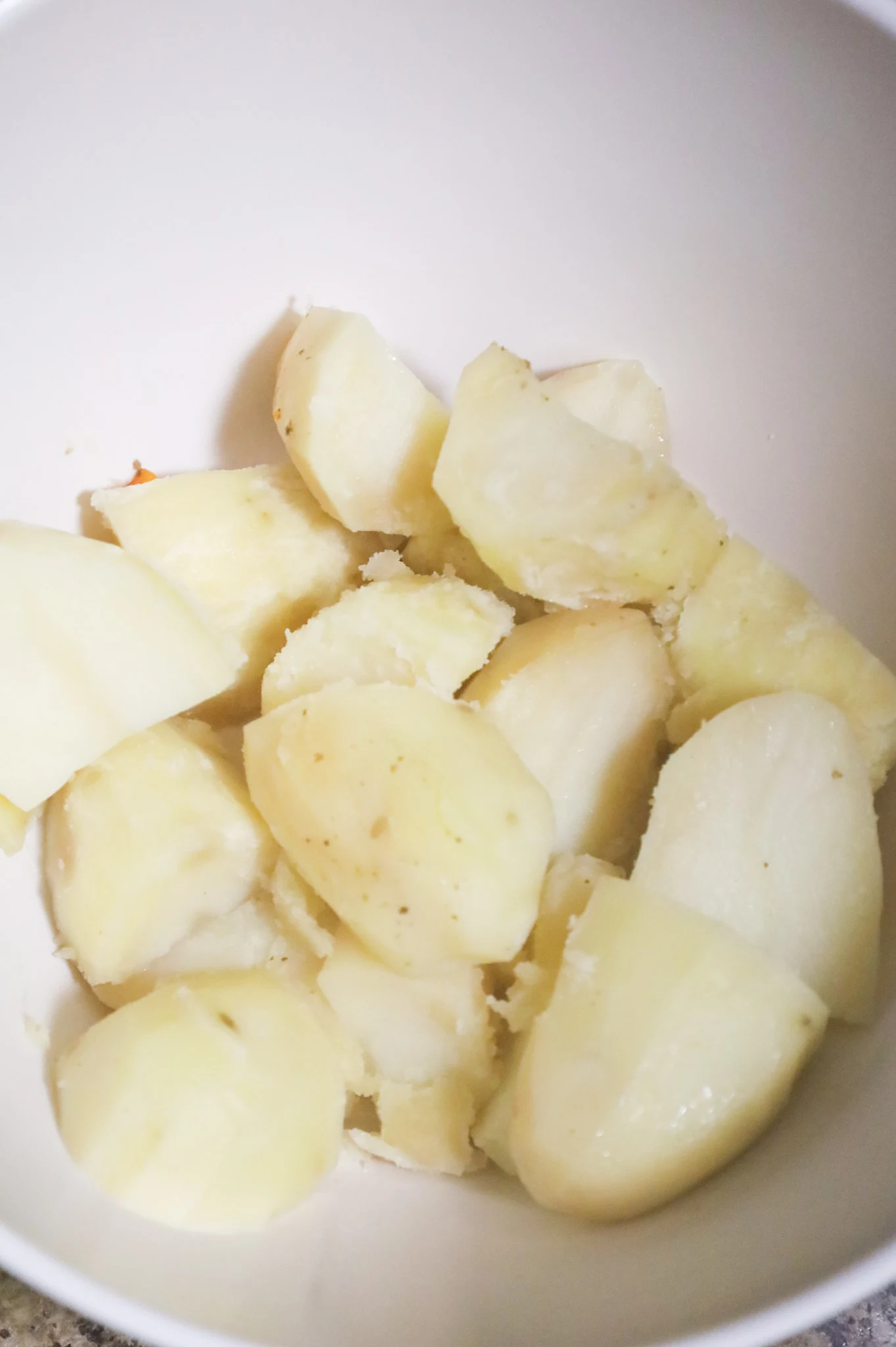 cooked potatoes in a mixing bowl