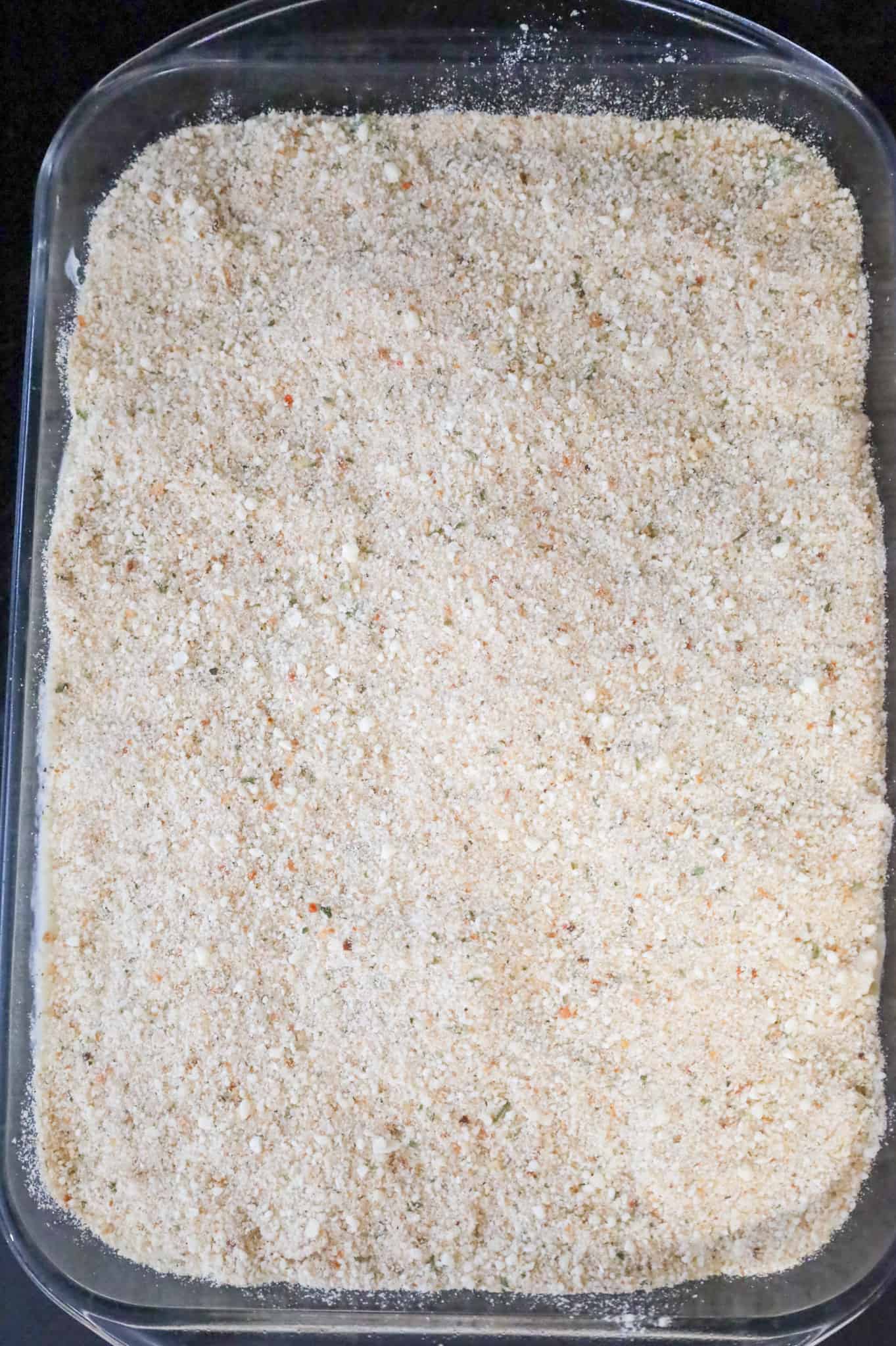 bread crumb mixture on top of chicken casserole in a baking dish