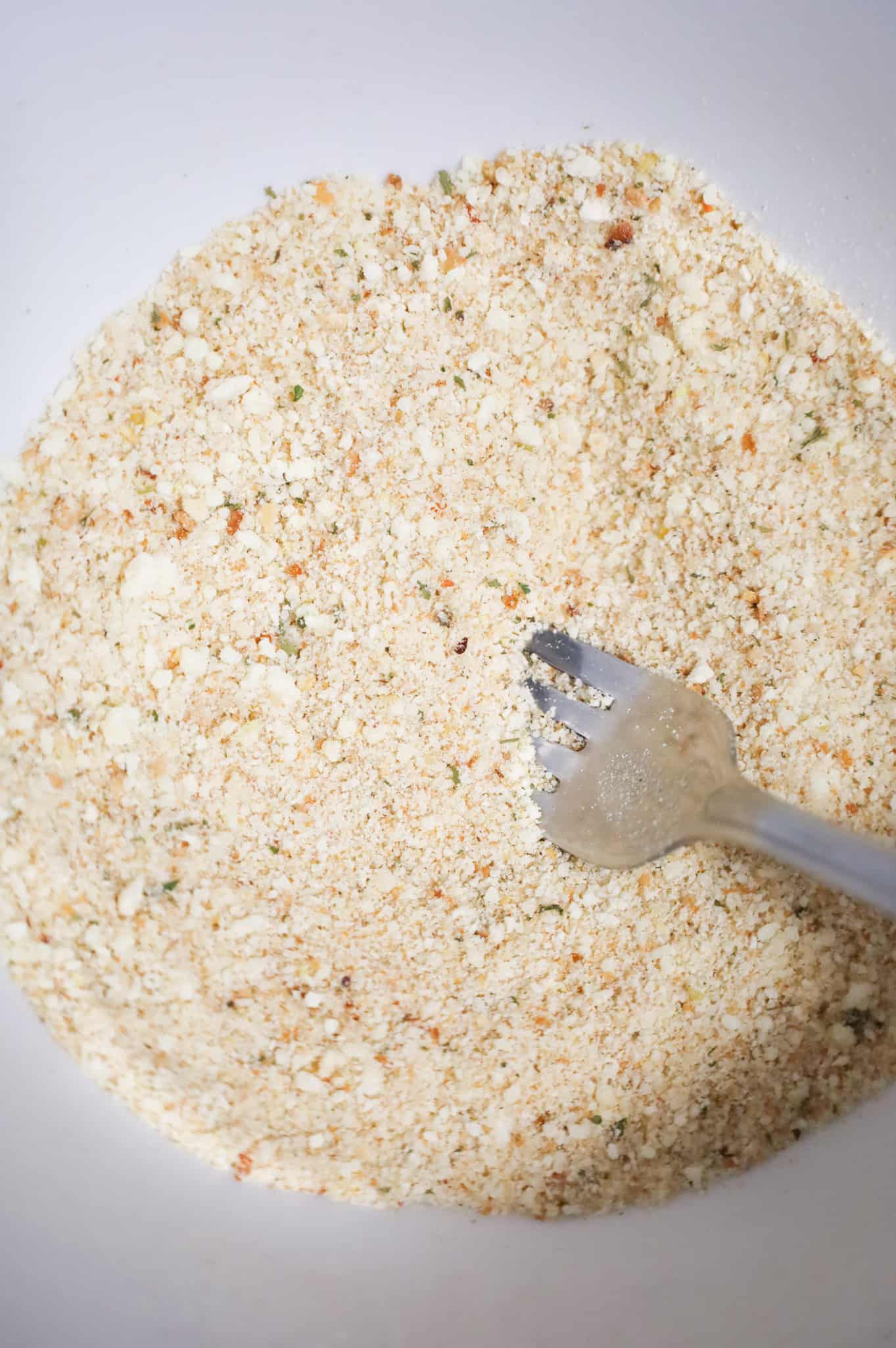 bread crumb and parmesan mixture in a mixing bowl