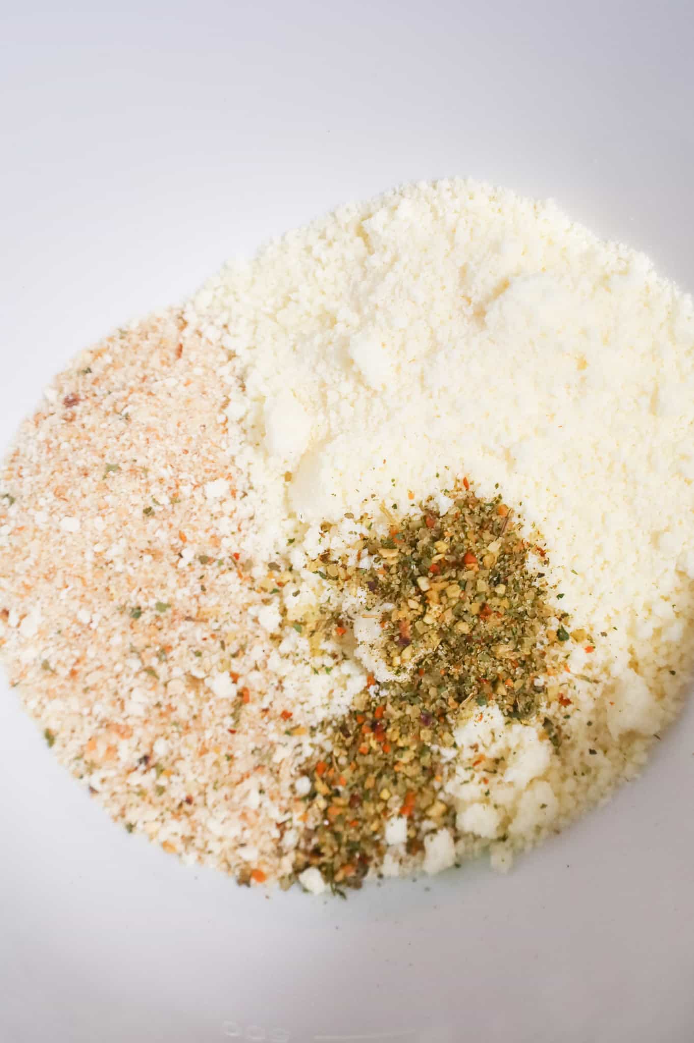 bread crumbs, grated parmesan and Italian seasoning in a mixing bowl