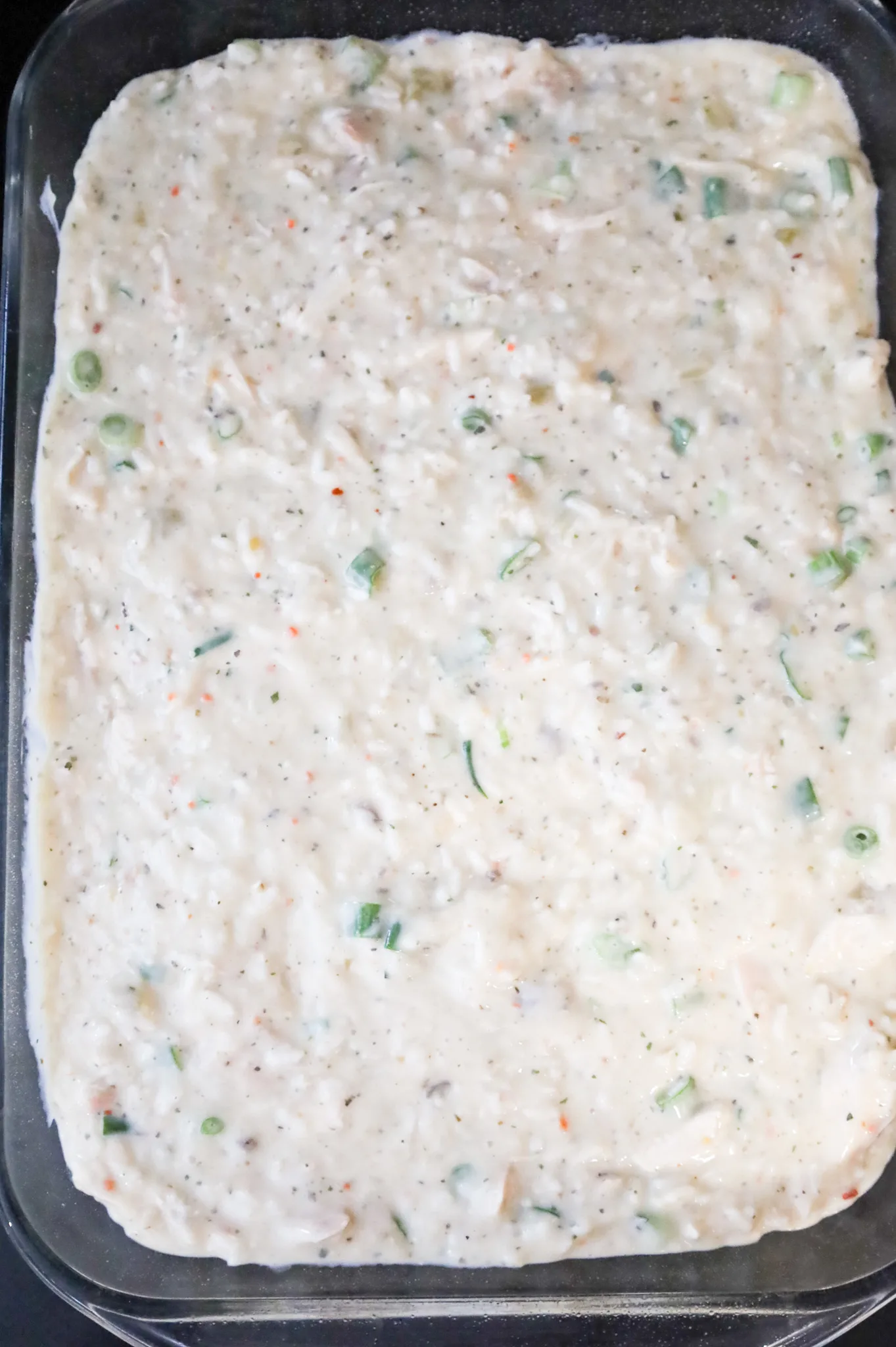 creamy chicken and rice mixture in a baking dish