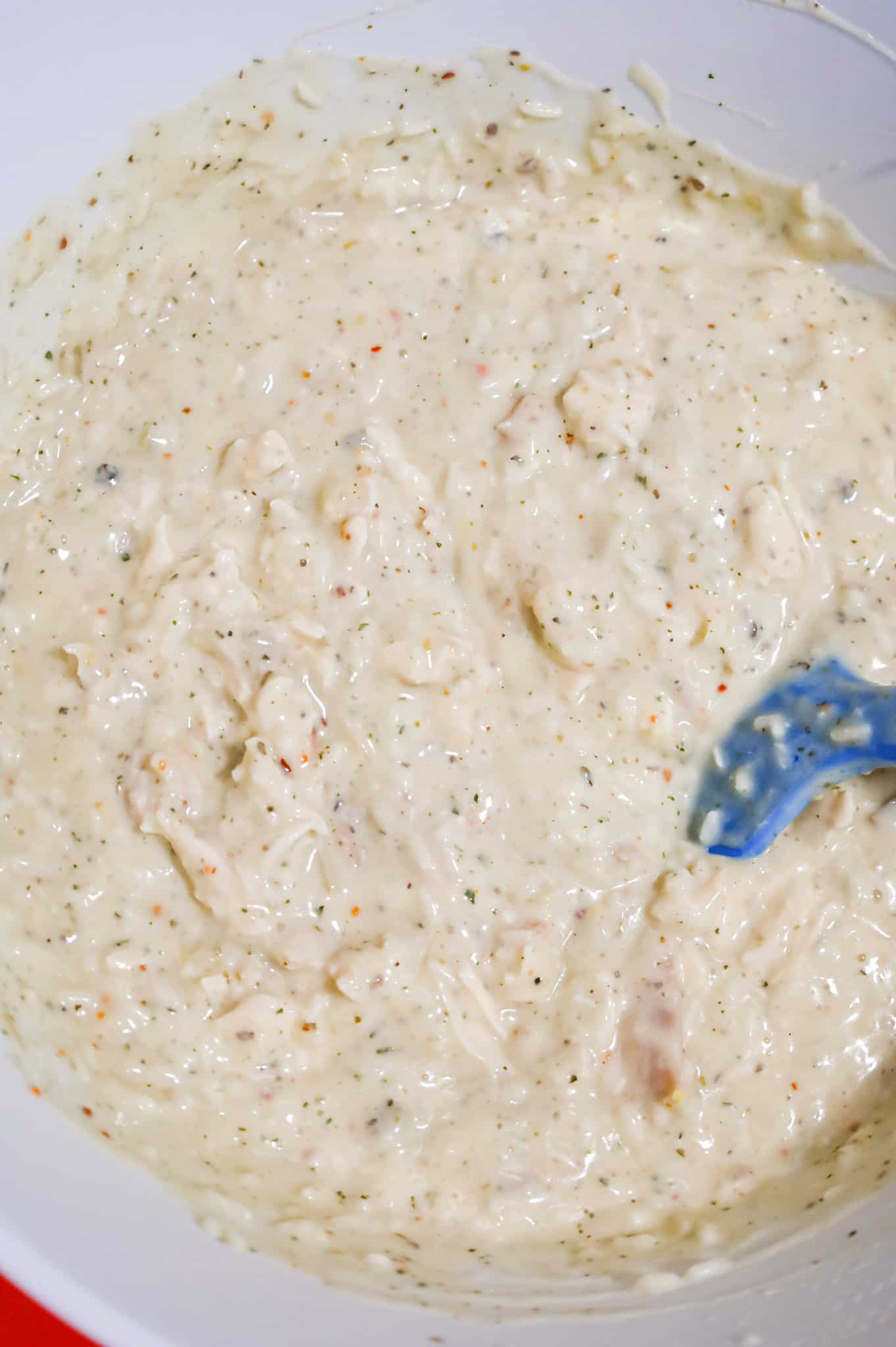 creamy chicken and instant rice mixture in a mixing bowl