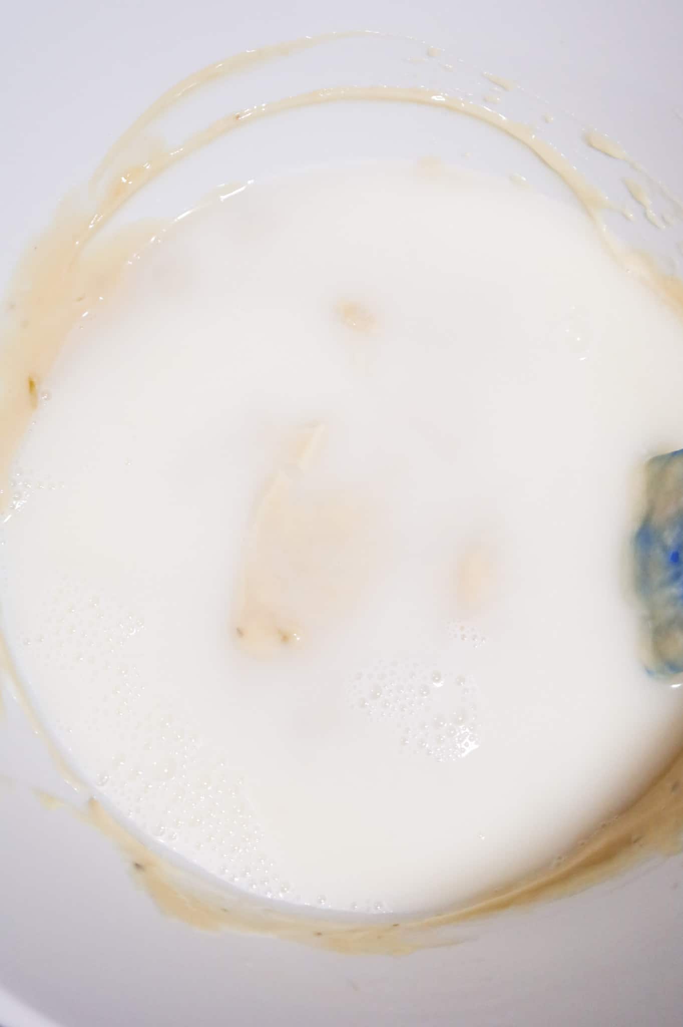 water and milk added to cream soup mixture in a mixing bowl
