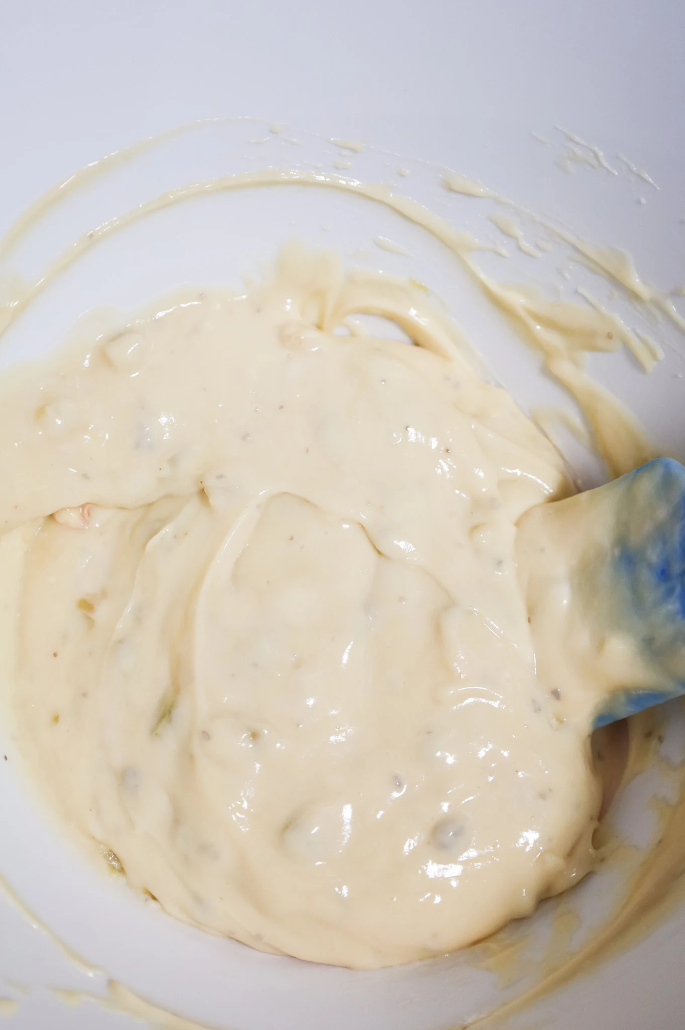 creamed soups being stirred together in a mixing bowl
