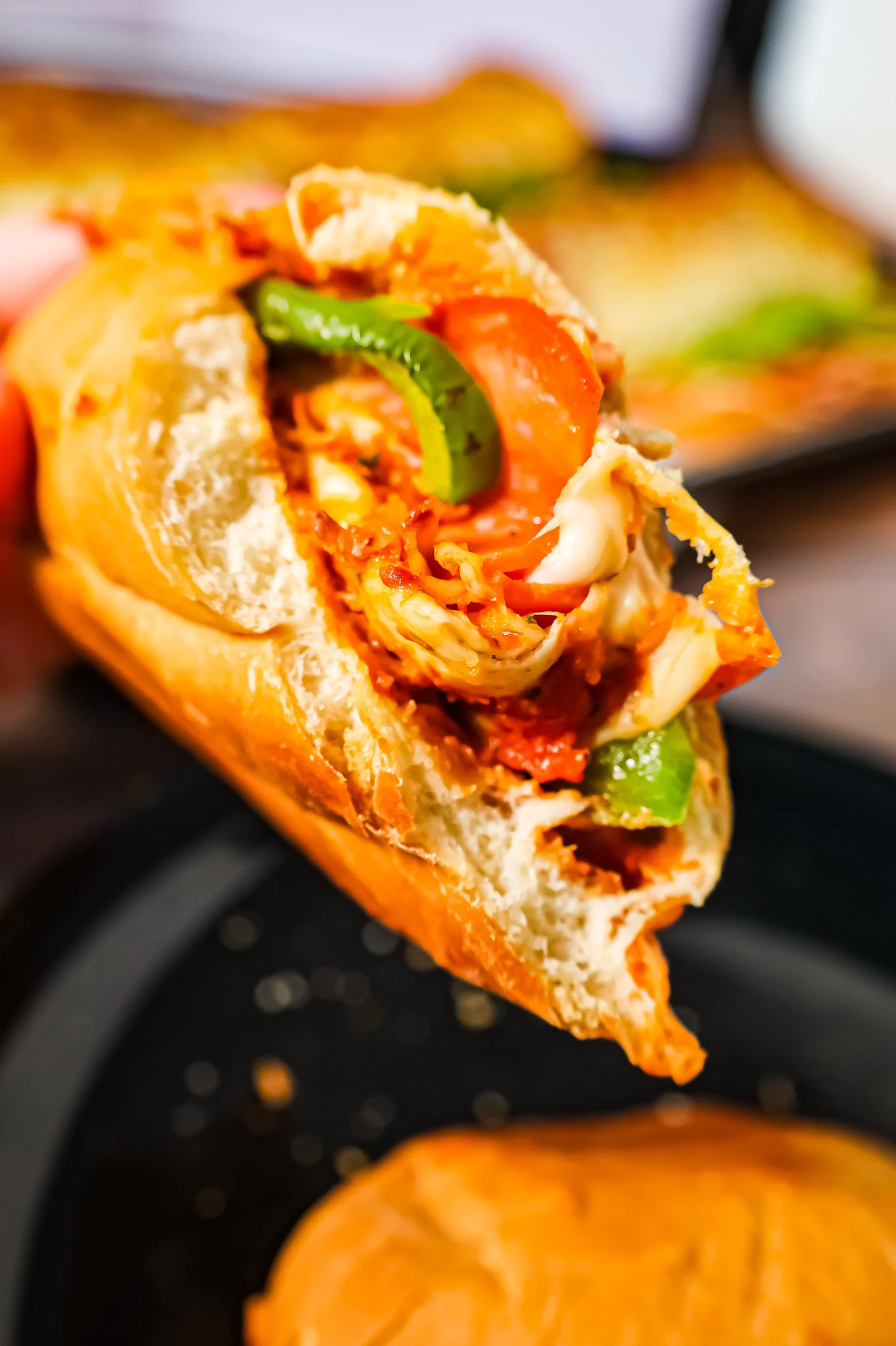 Pizza Subs are an easy weeknight dinner recipe using 9 inch sub rolls loaded with pizza sauce, mozzarella cheese, pepperoni and green peppers and then baked until perfectly toasted.