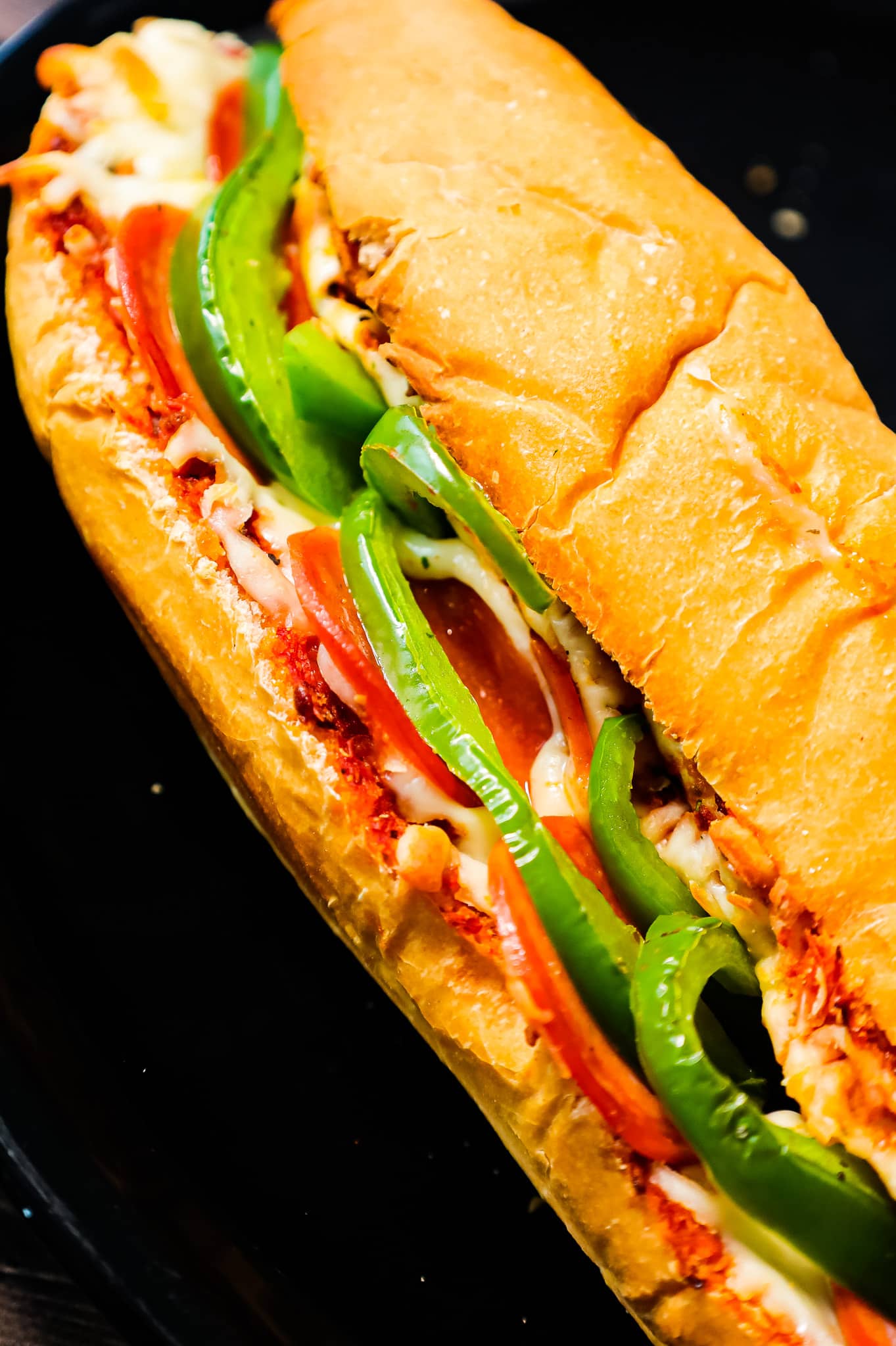 Pizza Subs are an easy weeknight dinner recipe using 9 inch sub rolls loaded with pizza sauce, mozzarella cheese, pepperoni and green peppers and then baked until perfectly toasted.