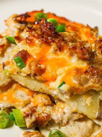 Sausage Potato Casserole is a hearty dinner recipe with layers of sliced potatoes loaded with crumbled Italian sausage and shredded sausage all cooked in a cream of mushroom soup and sour cream mixture.