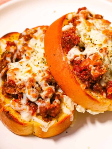 Texas Toast Sloppy Joes are an easy ground beef dinner recipe made with frozen Texas toast garlic bread slices and loaded with sloppy joe ground beef and shredded cheese.