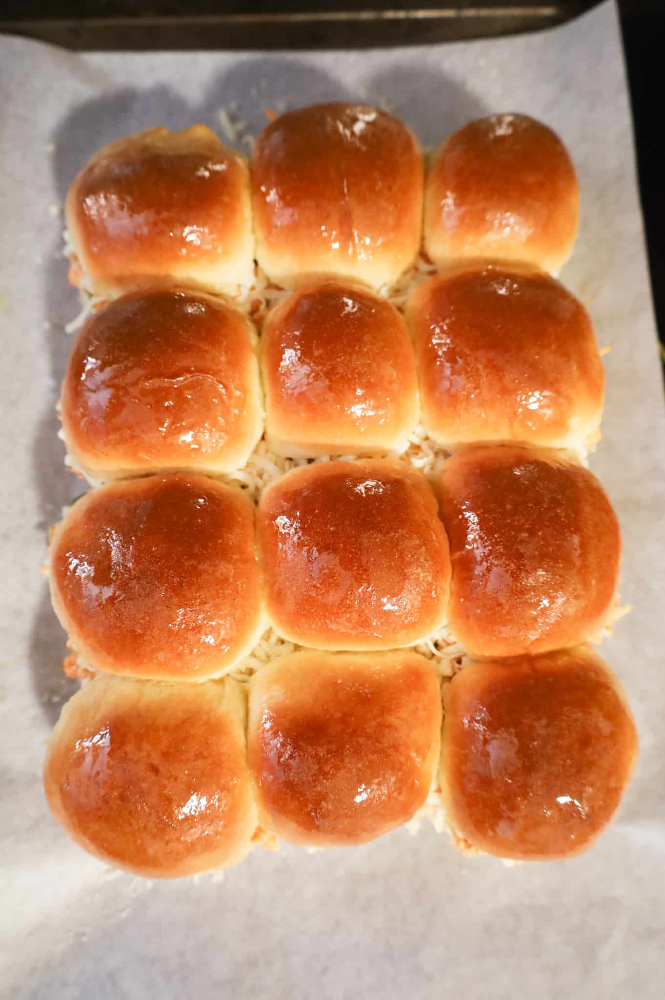 dinner rolls brushed with butter