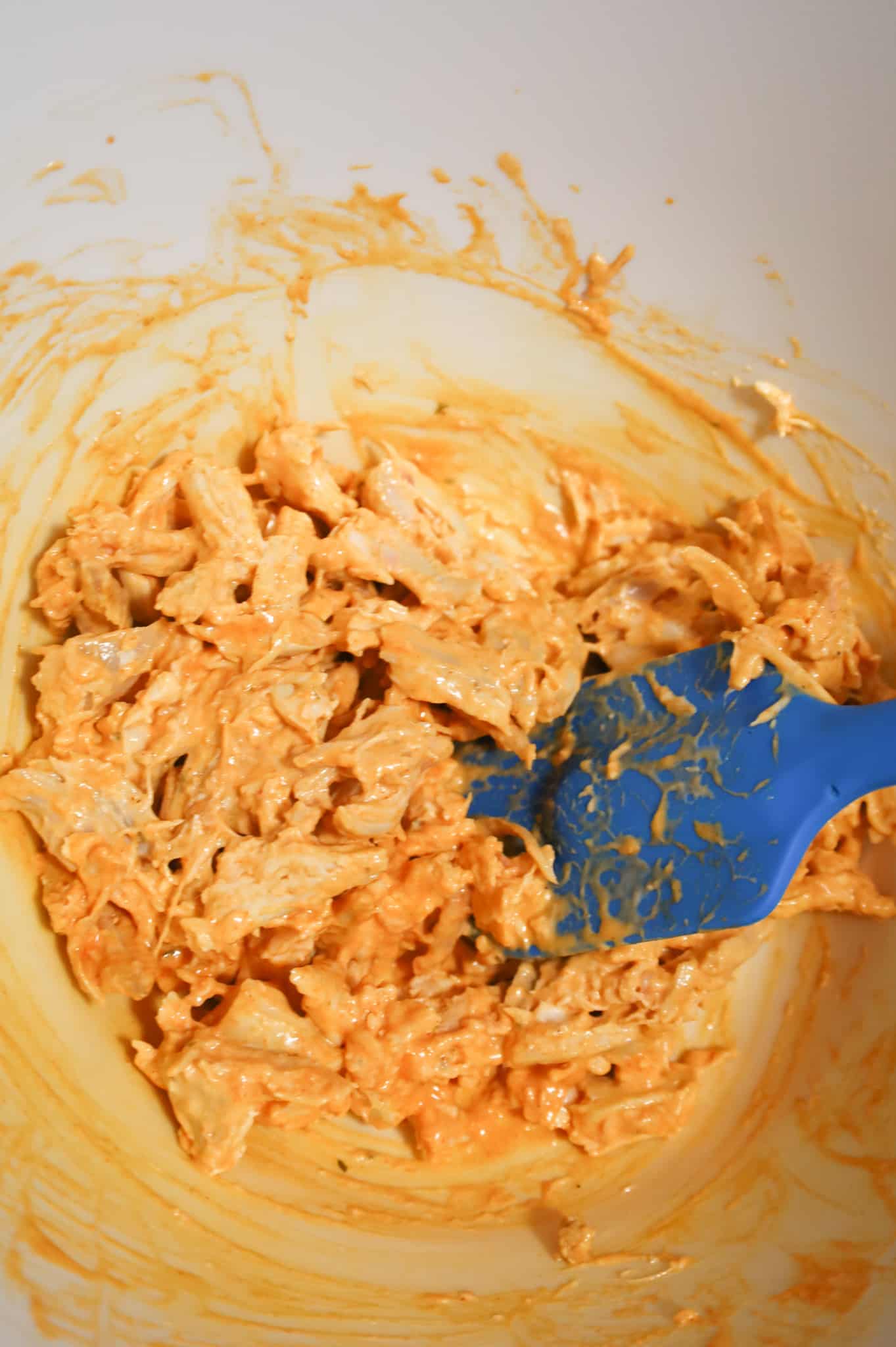shredded chicken coated with Buffalo sauce and ranch dressing