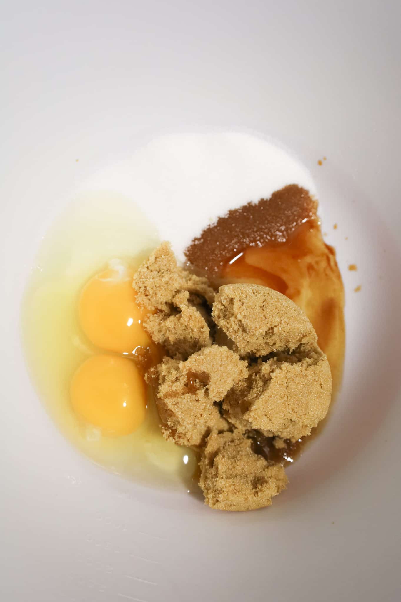 brown sugar, granulated sugar, eggs and vanilla extract in a mixing bowl